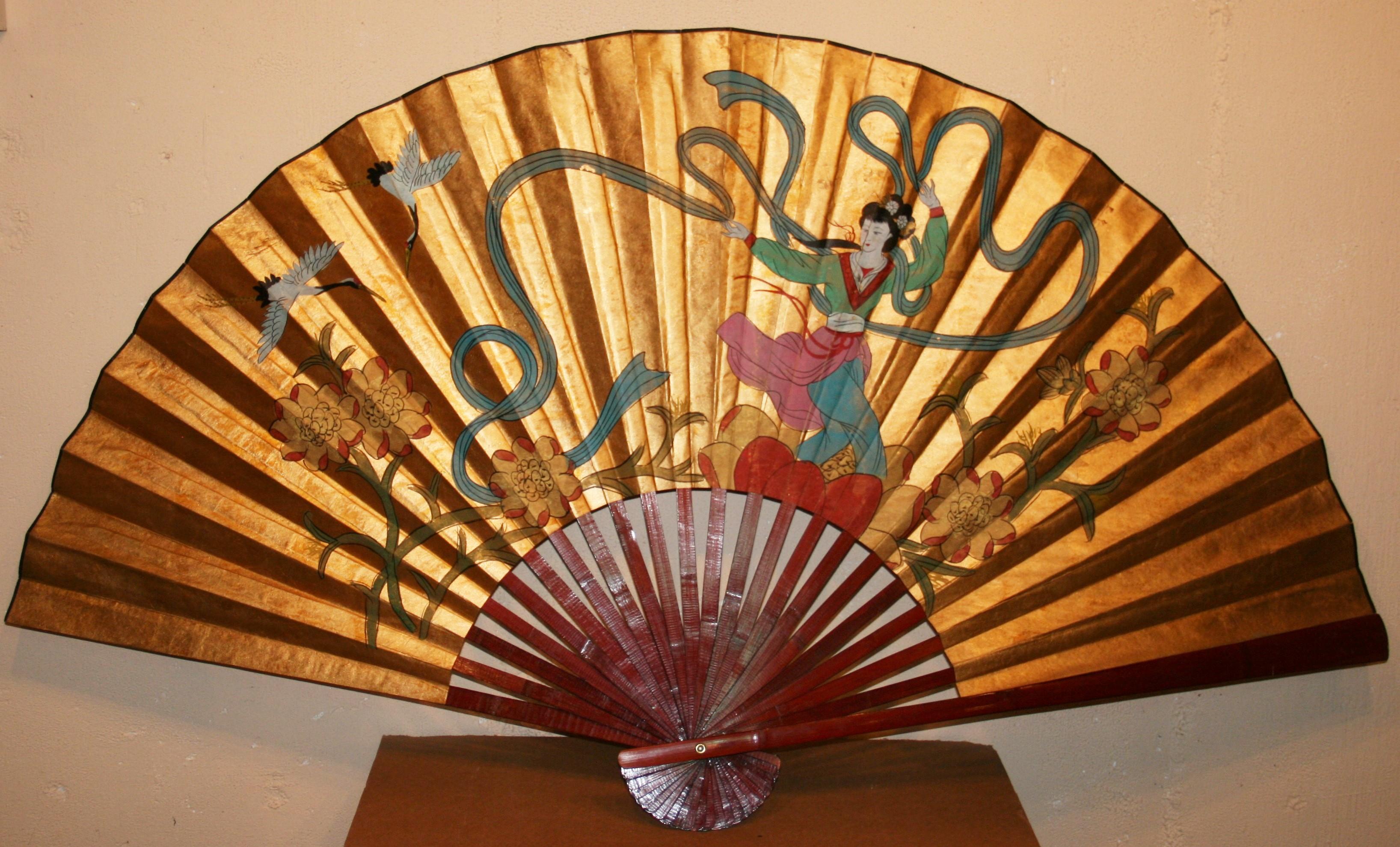 Monumental Chinese folding fan that is extra large when fully opened circa 1950's.
The colors are still incredibly vivid and the folding mechanism works.
Comes ready to hang on any wall with 2 hooks on back.