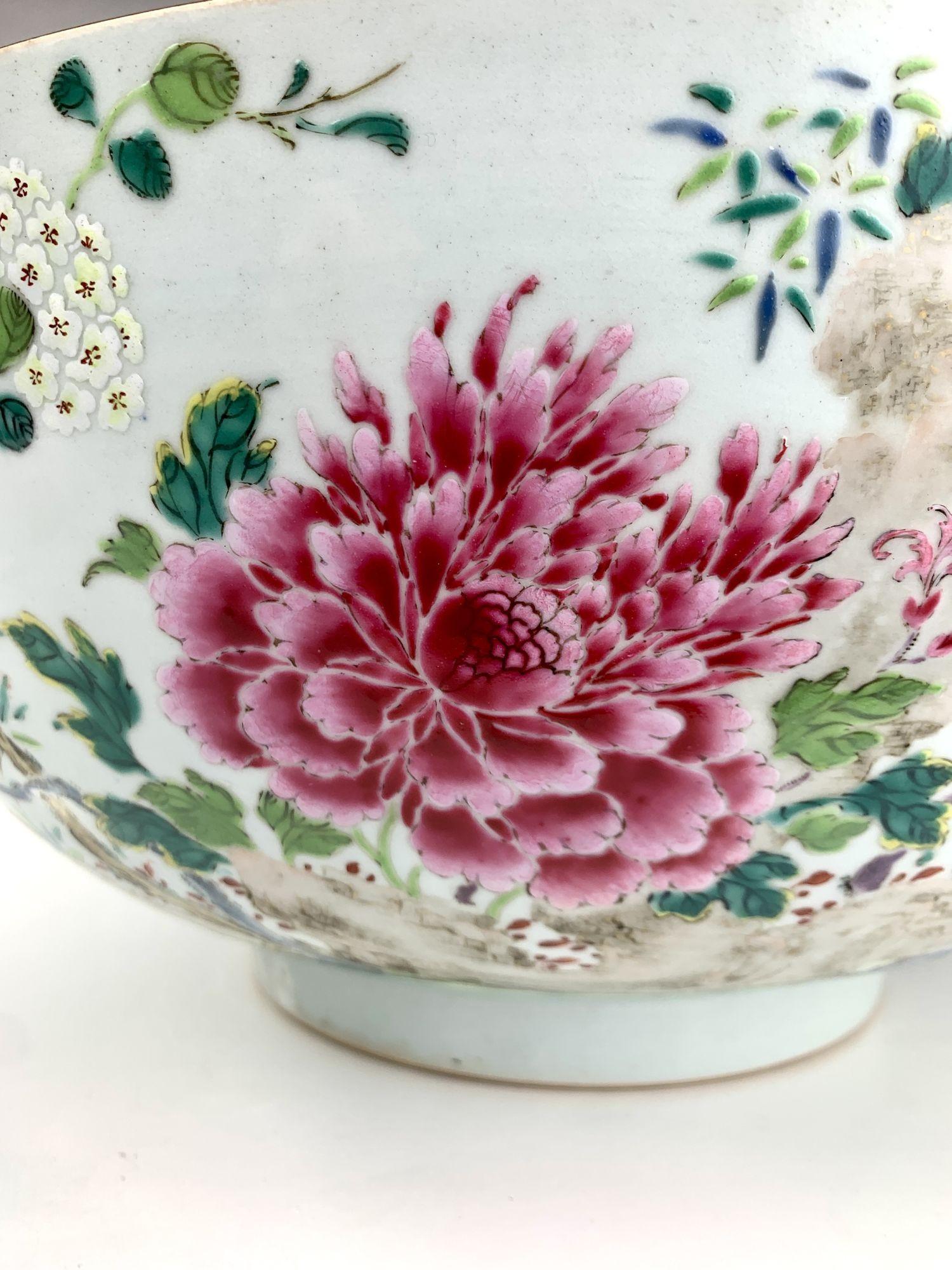 This is an altogether fabulous bowl!
This large antique Chinese porcelain punch bowl was hand painted in the Qianlong Period circa 1760.
The hand-painted Famille Rose decoration is exquisite and vibrant.
We see lifelike carp beautifully painted in