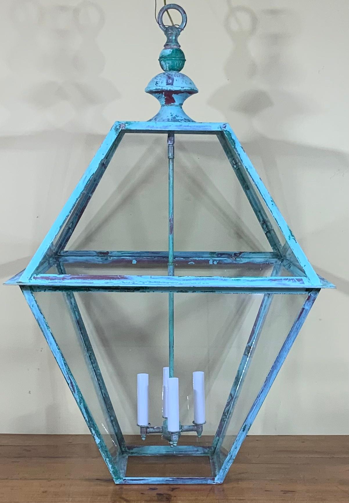 Elegant large hanging lantern made of handcrafted solid copper, great green - turquoise patina. Measures: 22” x 22” x 36”
With four 60/watt lights, suitable for hanging in wet location, up to US code. Ready to use.
Matching canopy included.
