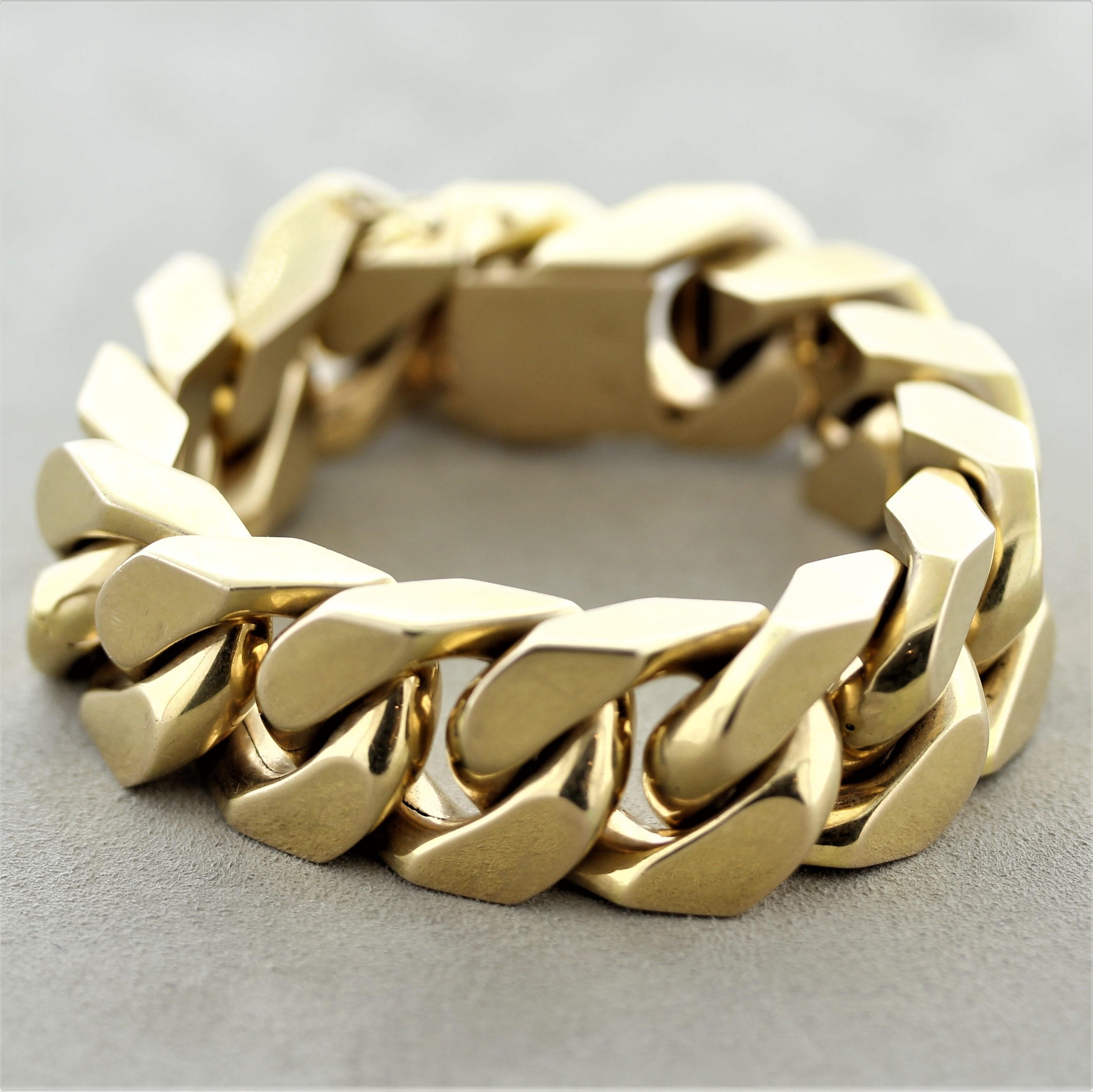A large and chunky gold bracelet featuring Cuban links made in 18k yellow gold. The links are hollow inside giving it a lighter weight and making it more comfortable to wear. Made in solid 18k gold and ready to be worn.

Length: 8 inches

Width: 0.8