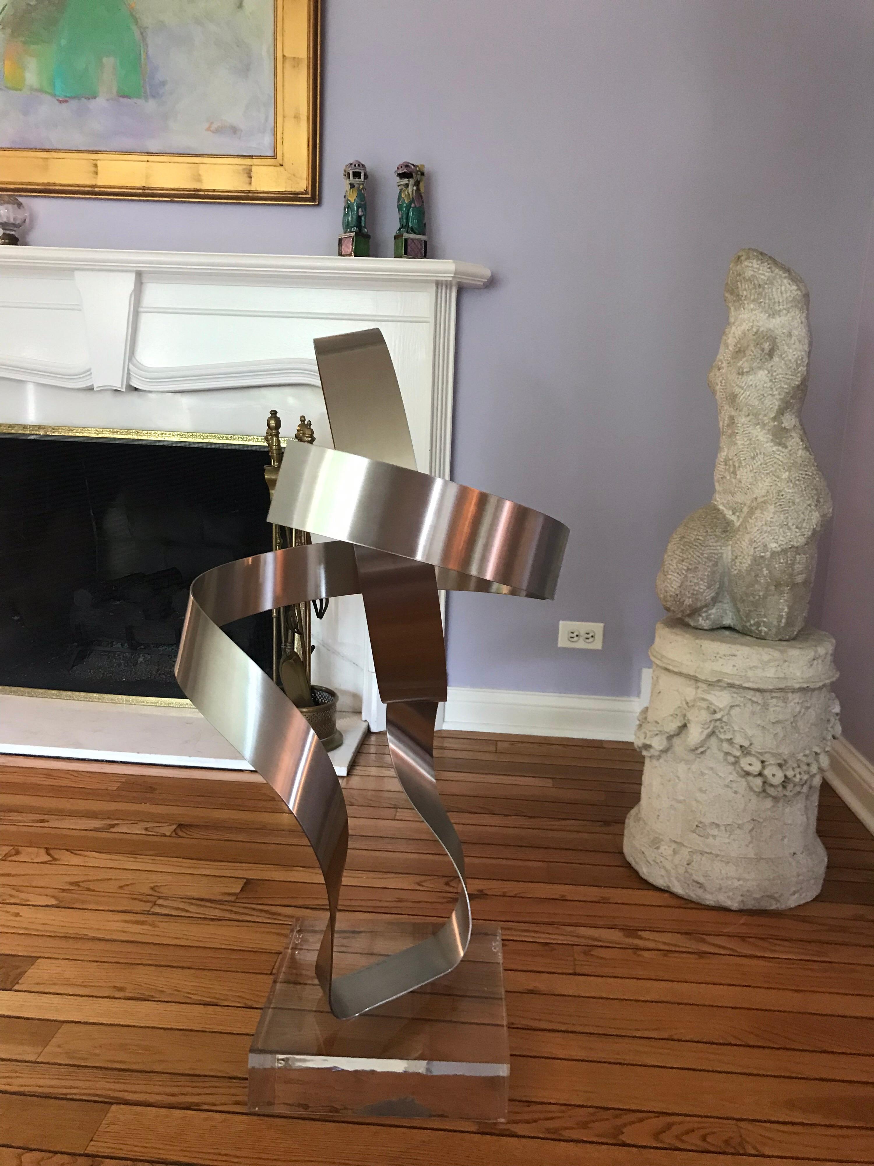 This is the first out of 25 of these extra large abstract metal sculptures made in 1978 by Dan Murphy It is mounted on a 12 x 12 x 3 Lucite base.