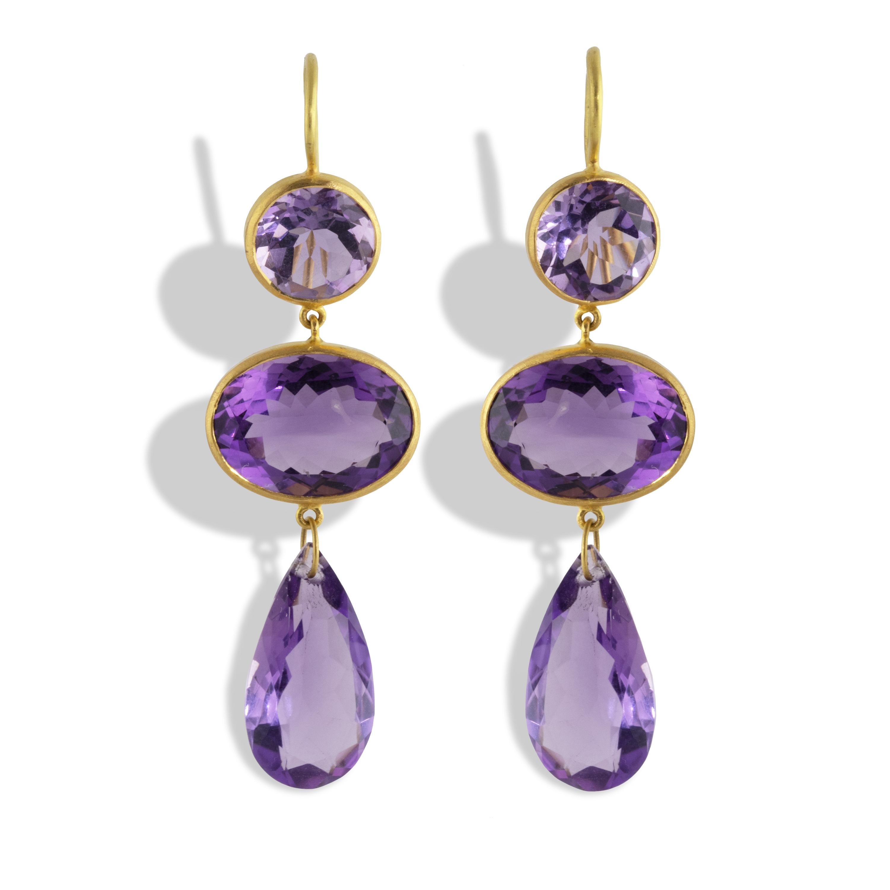 Spectacular statement earrings made from 35.64 carats of Brazilian Amethyst and set in 22k yellow gold.  
Measuring 58mm long (2.25