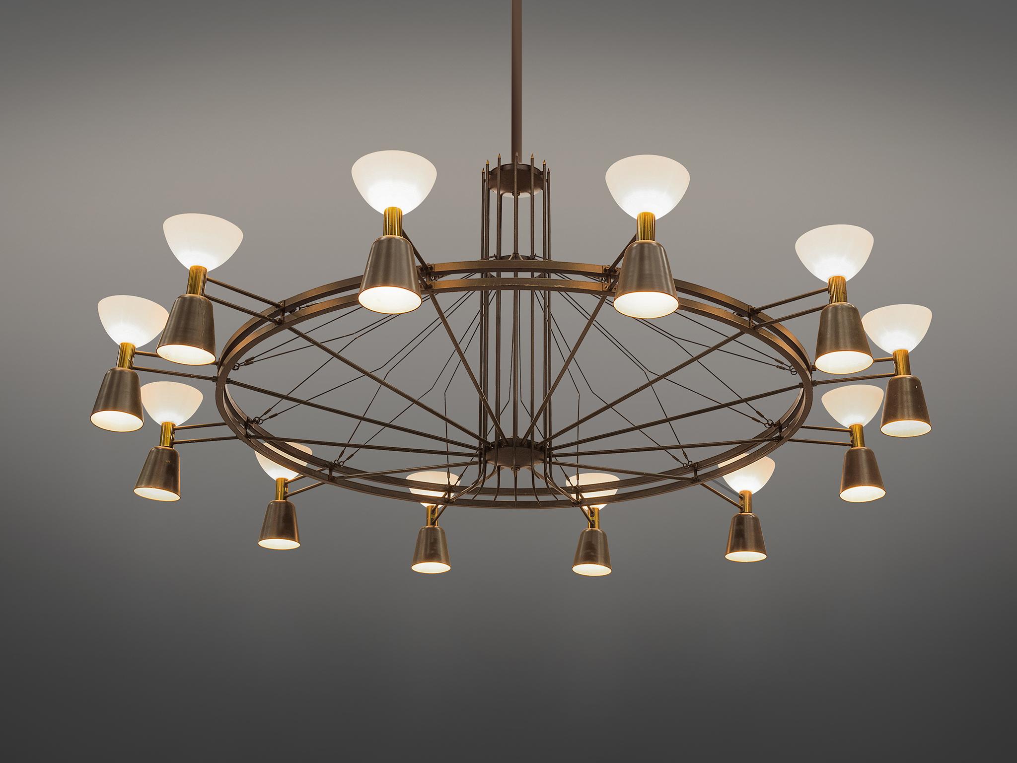Chandelier, metal, glass, The Netherlands, circa 1950.

This large Dutch chandelier is made in the 1950s by a local designer in the Eastern region of the Netherlands. The chandelier features twelve shades that shine both upwards and downwards. The