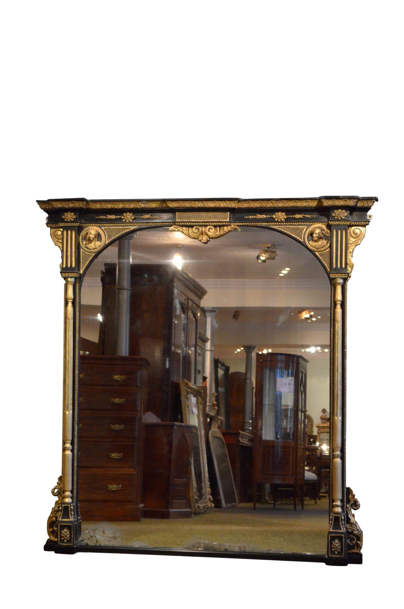 K0613 Outstanding English Victorian wall mirror, having original glass with some foxing and imperfections in moulded and ebonised frame with beaded inner and outer edge, cavetto cornice with foliage carving, shallow frieze with latticework centre