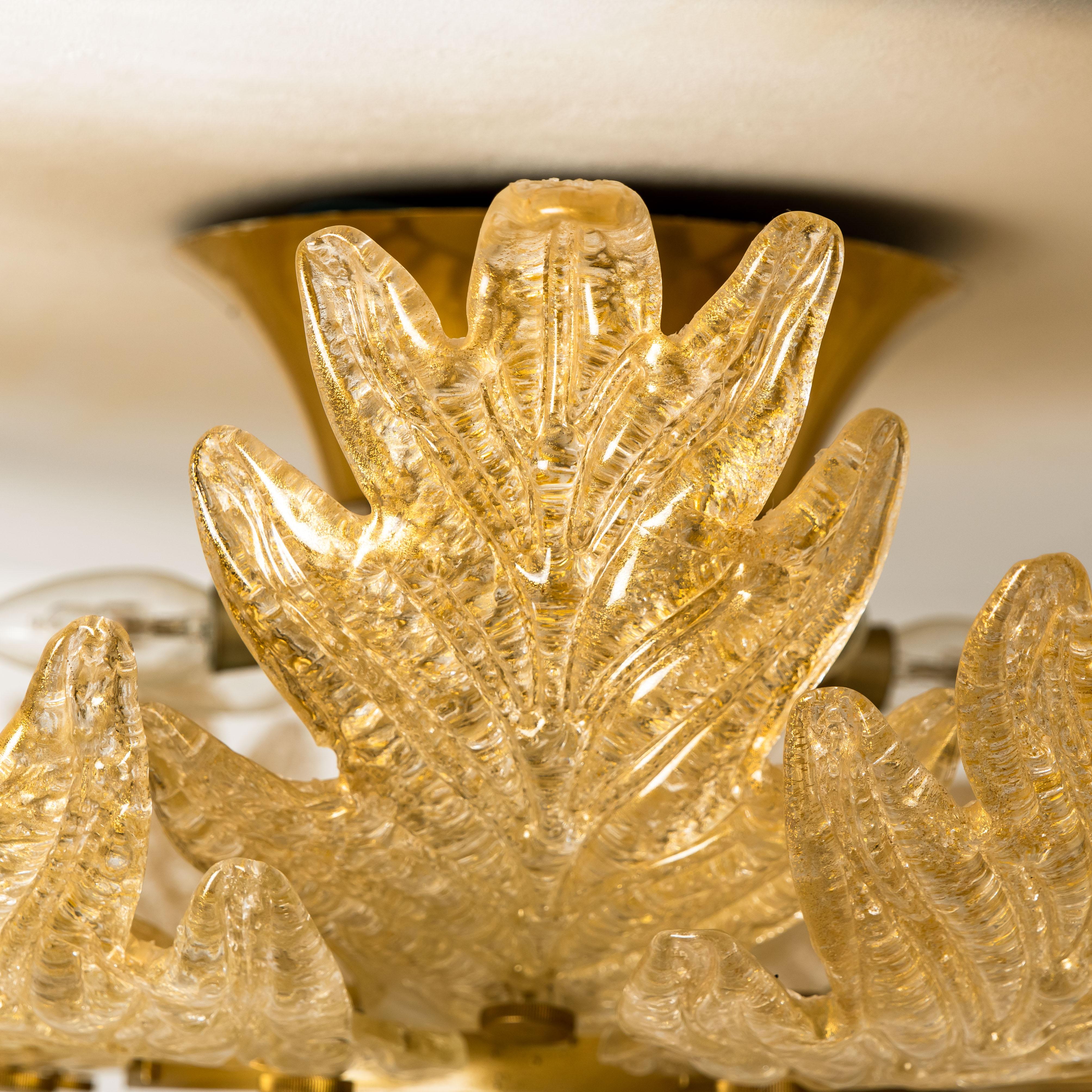 An elegant hand blown Murano glass flush mount of Barovier & Toso.The light fixture consists 16 blown Murano glass leaves. Mounted on a brass frame. The leaves refract light beautifully. The flush mount fills the room with a soft, warm and welcoming