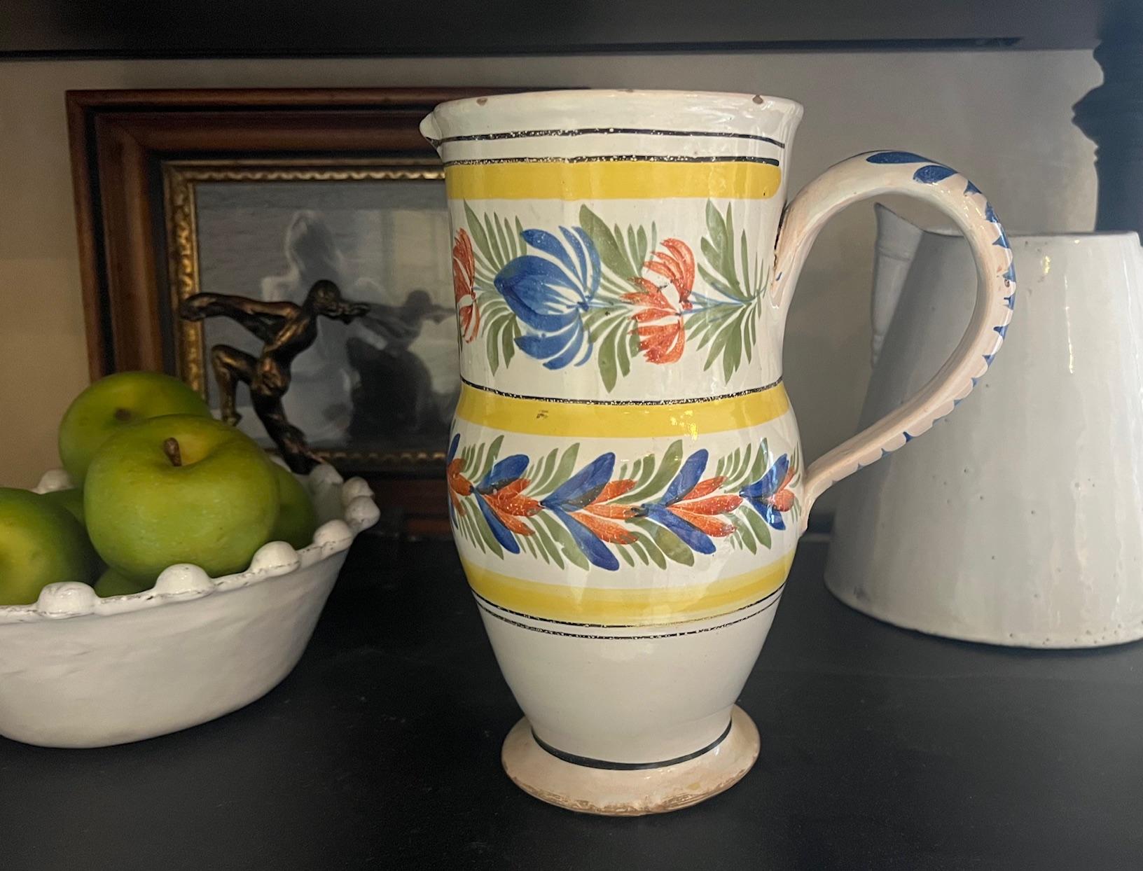 Hand painted floral French faience pitcher, made in France by Quimper in the first half of the 19th century.   The extra large piece is unsigned as is usual for Quimper until around the 1870's.