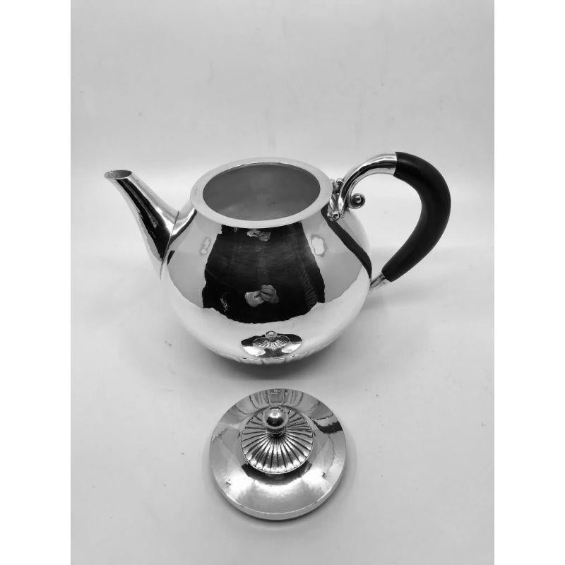 A vintage sterling silver Georg Jensen teapot with ebony handle, design #45C by Johan Rohde from 1915, this is a larger than usual size teapot.
This design often referred to as “Cosmos”.

Additional information:
Material: Sterling silver
Styles: Art