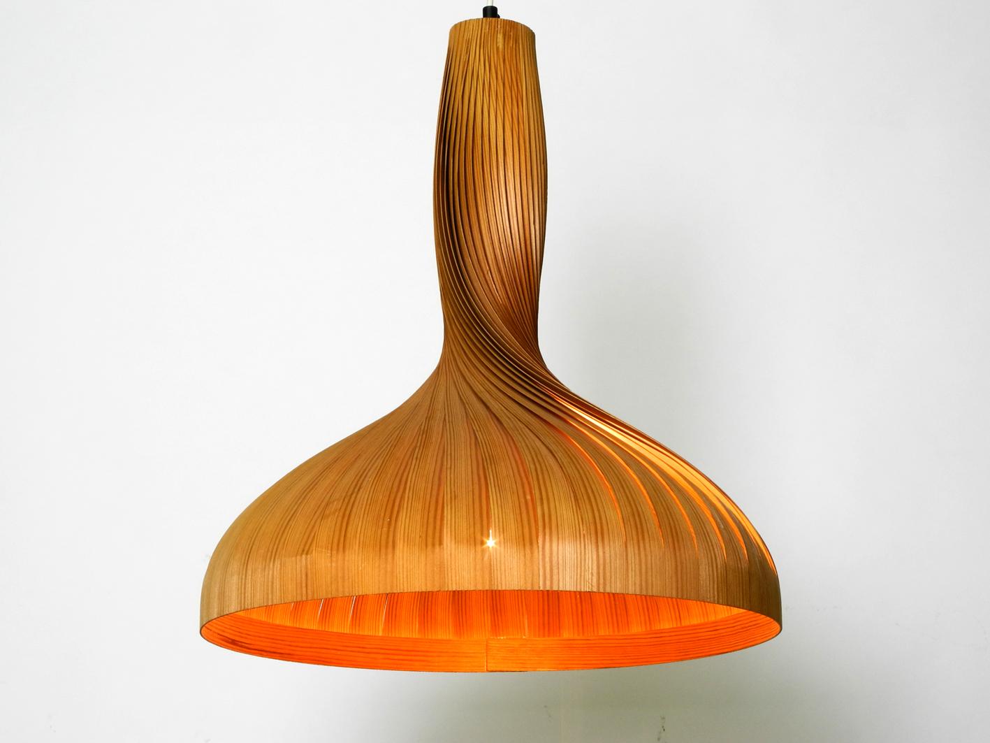 Elegant large Hans Agne Jakobsson pendant light for Markaryd, Sweden. Made of wood stripes twisted and bent into a very nice shape. An original from the 1960s in very good condition. Very elegant great design and popular classic. 100% original