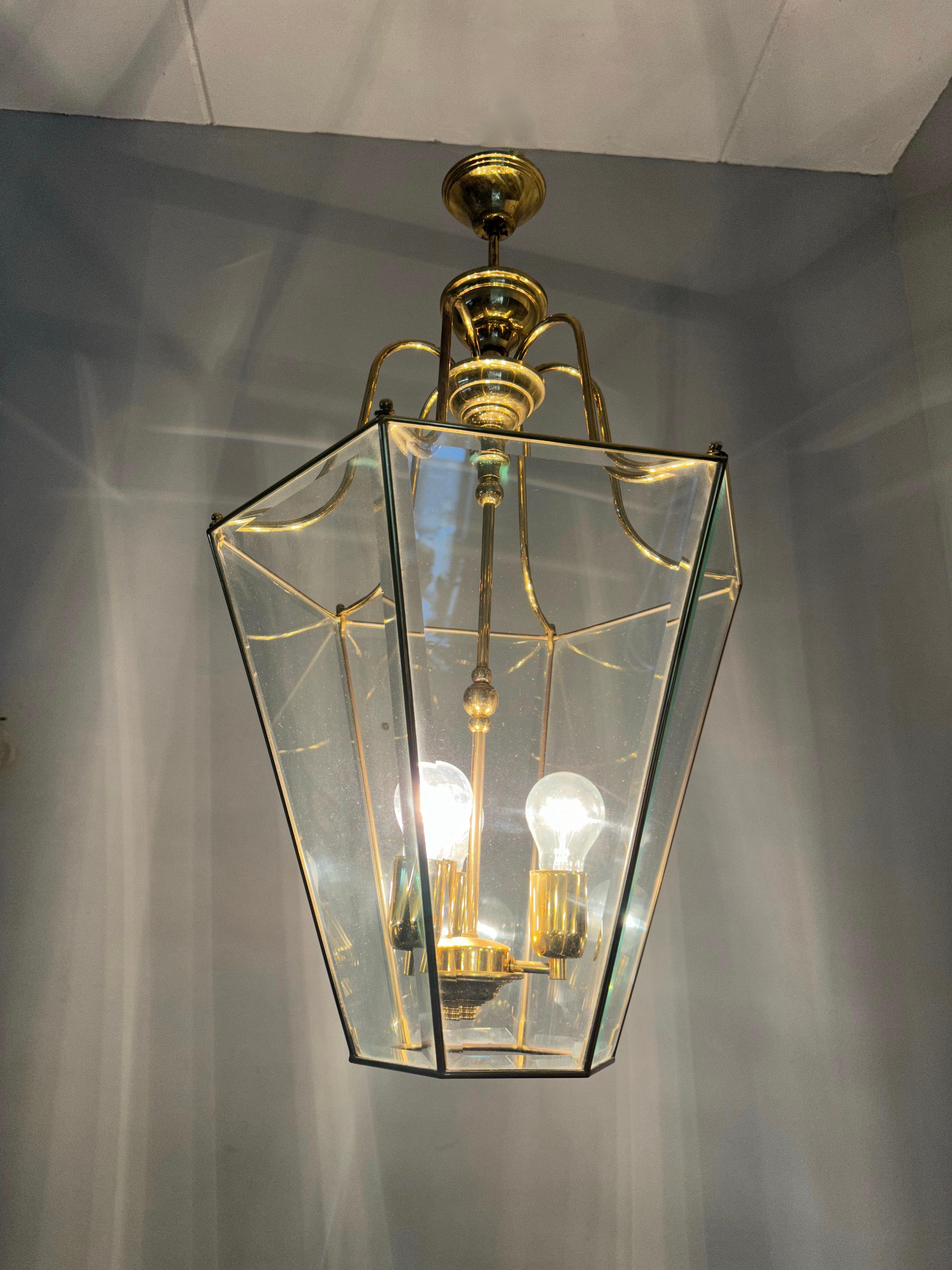 Patinated Extra Large Highly Stylish Brass and Beveled Glass Pendant Light Ceiling Lantern For Sale