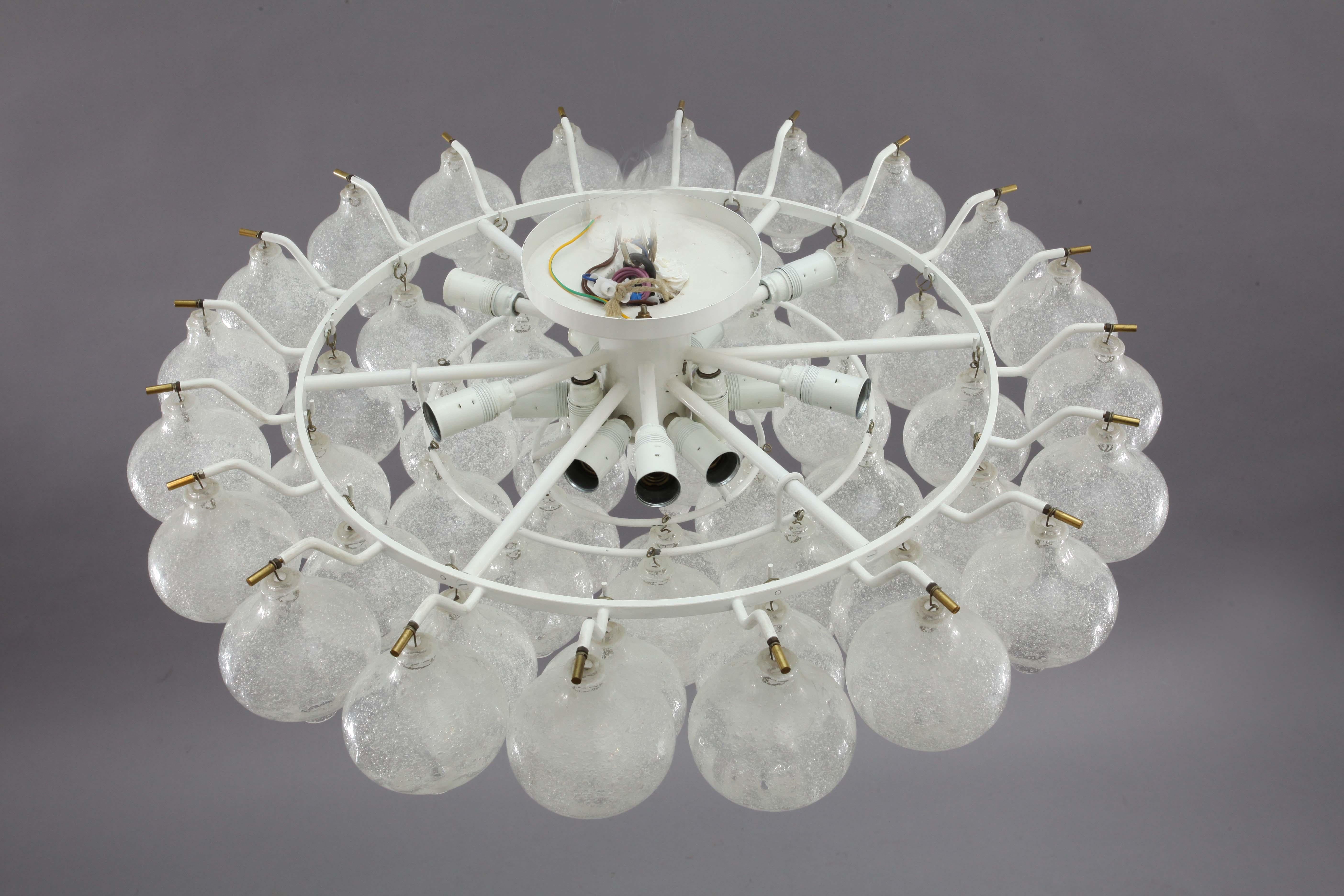 An extra large and gorgeous 'Tulipan' flush mount chandelier by J.T. Kalmar, Austria, Vienna, manufactured in midcentury, circa 1970 (late 1960s or early 1970s).
The name Tulipan derives from the tulip shaped hand blown bubble glasses. Fifty-one