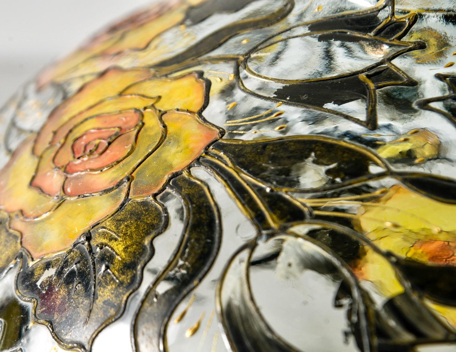 Extra large clear glass vase standing over 12” high and 15” in diameter with an intricately hand painted decoration of yellow roses and leaves, circa 1970s. Paint has a raised texture and stained-glass look in that it’s not opaque. The large scale