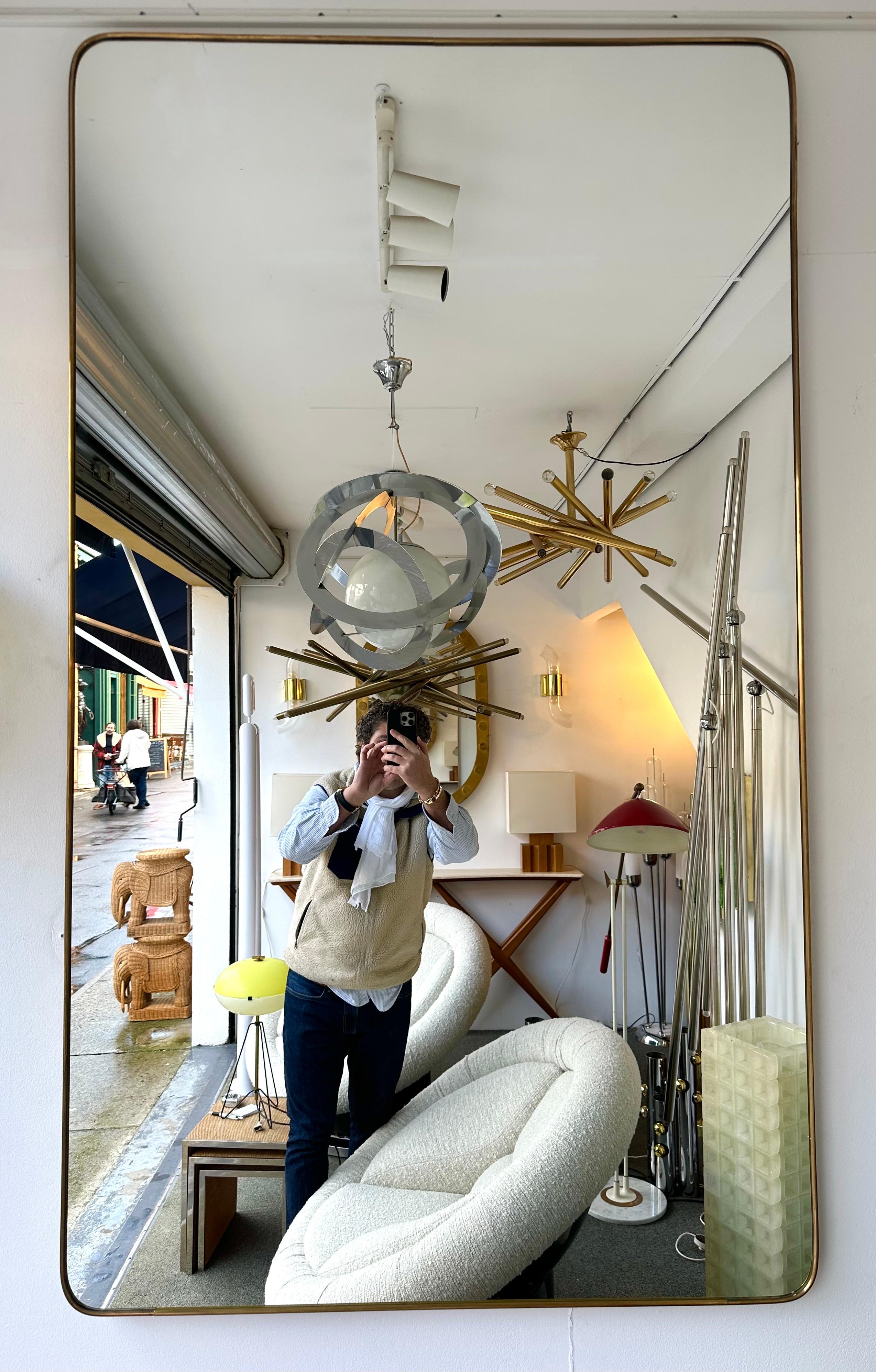 Extra large Mid-Century Modern brass frame mirror. Italian architect Gio Ponti placed this style of mirror in his interiors during the 1950s and 1960s. Same design period as Fontana Arte, Cristal Art, Pier Luigi Colli, Ico Parisi, Cesare Lacca,