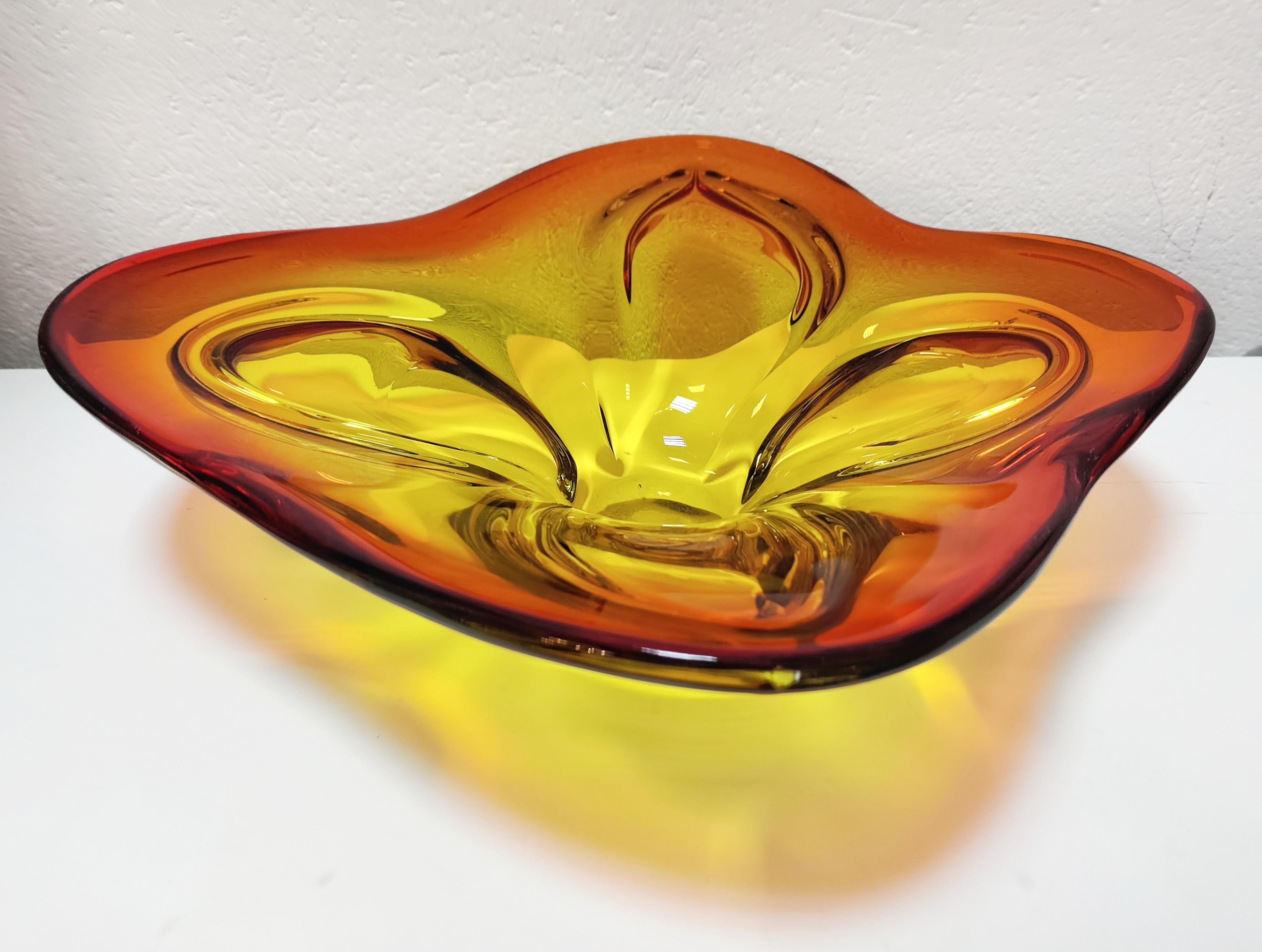 In this listing you will find a gorgeous Mid Century Modern Murano Glass Centerpiece or a large fruit bowl. It features beautiful, organic shape and vibrant colours. Excellent vintage condition. No dents in glass. Made in Murano, Italy in 1970s.
