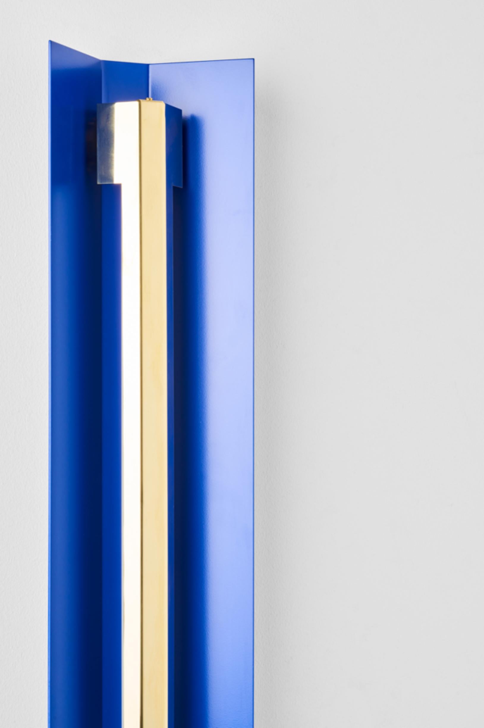 Extra large misalliance ex ultramarine wall light by Lexavala.
Dimensions: D 16 x W 160 x H 8 cm
Materials: Powder coated shade with details made of brass or stainless steel.

There are two lenghts of socket covers, extending over the LED. Two