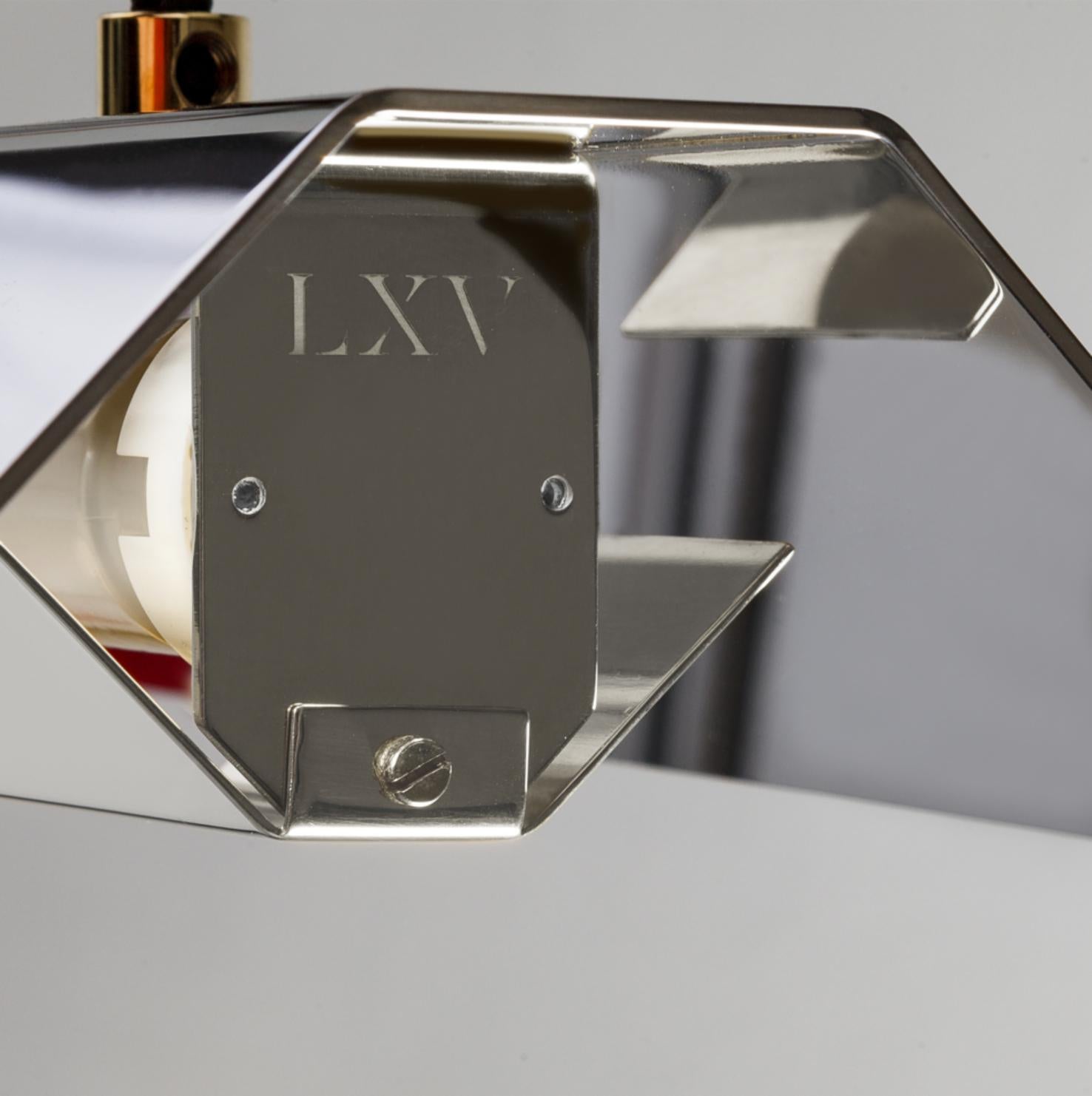 Extra large Misalliance inox suspended light by Lexavala
Dimensions: D 16 x W 160 x H 8 cm
Materials: Stainless steel.

There are two lenghts of socket covers, extending over the LED. Two short are to be found in Suspended and Surface, and one