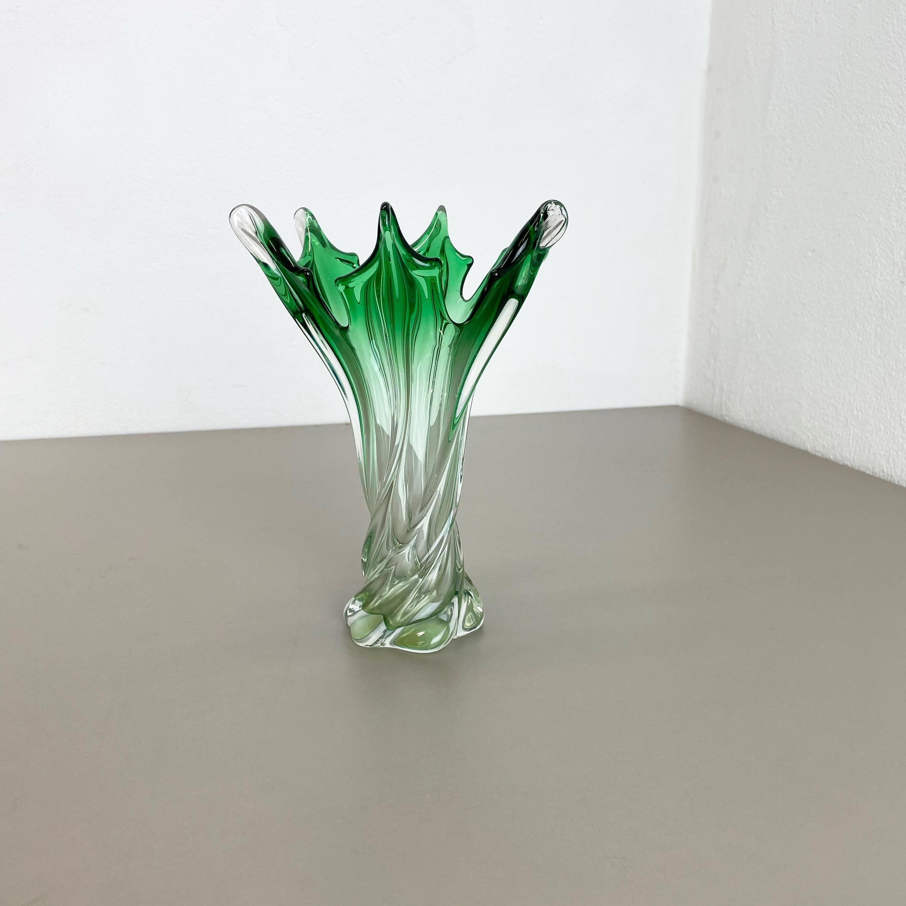 Article:

Murano glass vase


Origin:

Murano, Italy


Decade:

1970s


This original glass vases was designed and produced in the 1960s in Murano, Italy. It is made in Sommerso Technique with several different color inside the vase