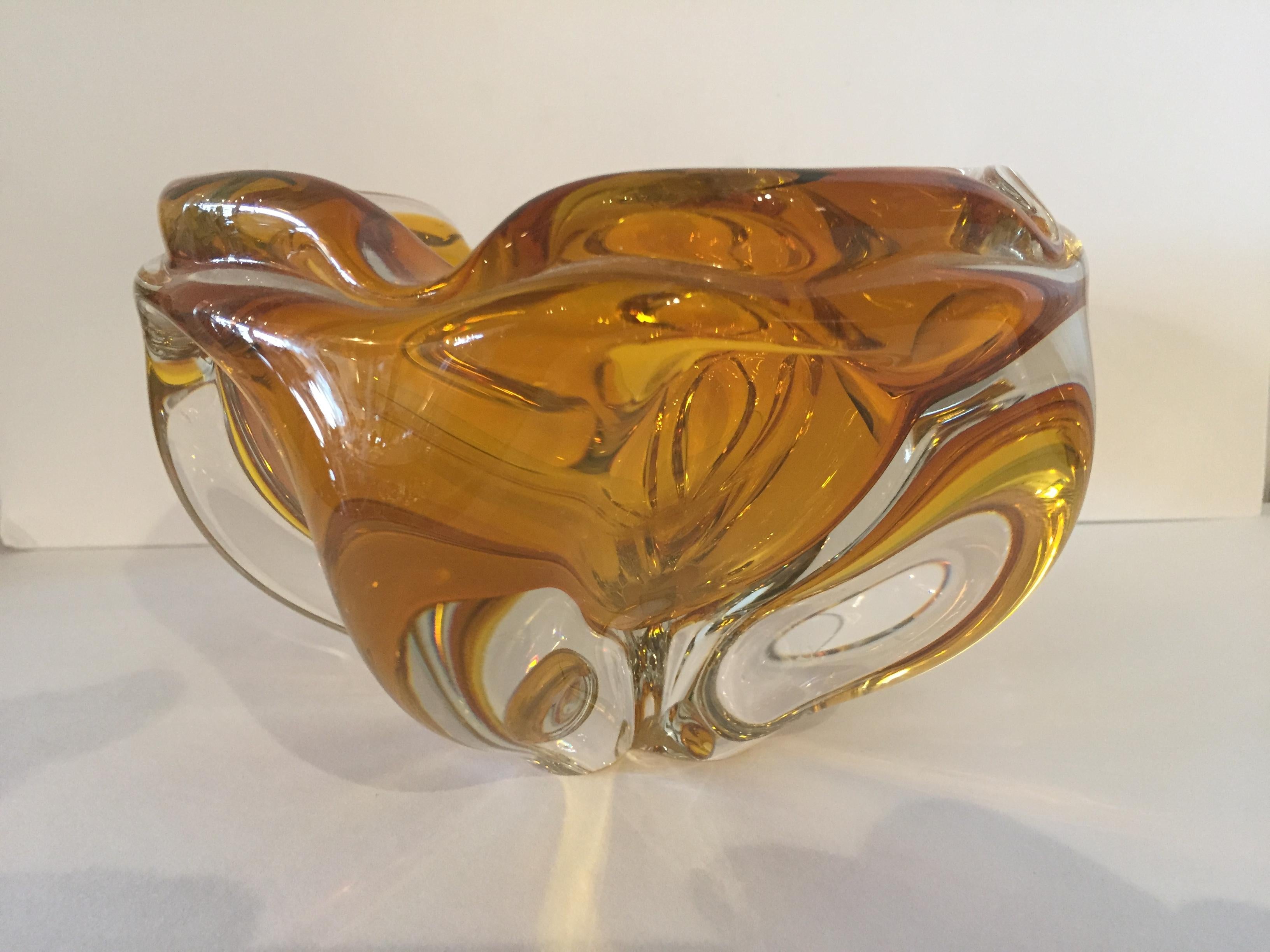 Murano Italian vintage extra large vintage citrine and clear to amber colored ash tray, with original Christie’s label and date auctioned, 1983 .This is in a bowl shape with several ribs for cigars or cigarettes ,but could also float a large flower