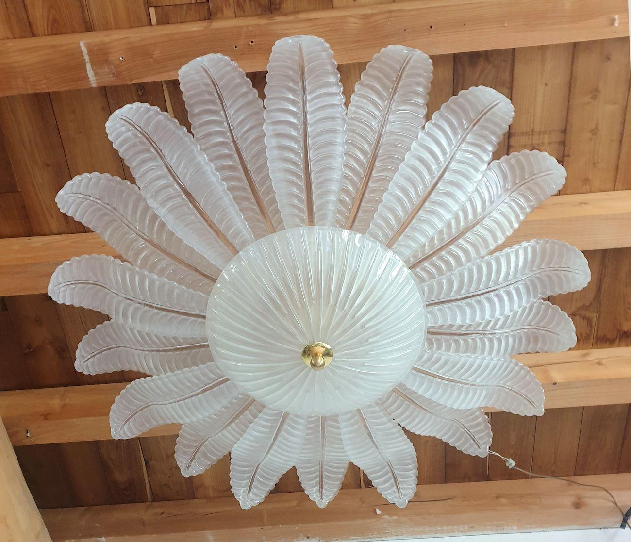 Extra large Leaf Murano glass Mid-Century Modern flush-mount chandelier, by Barovier and Toso, Italy 1970s.
The Vintage Chandelier is made of large frosted Murano glass leaves and a center bowl, on a gold plated frame.
The glass is translucent,