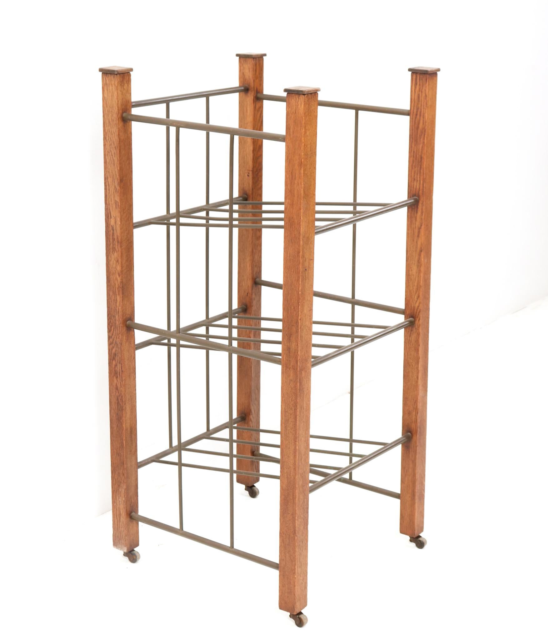 Magnificent and rare extra large Art Deco Modernist magazine rack or stand.
Striking Dutch design from the 1920s.
Solid oak frame with original patinated brass tubes.
This wonderful extra large Art Deco magazine rack or stand is in very good