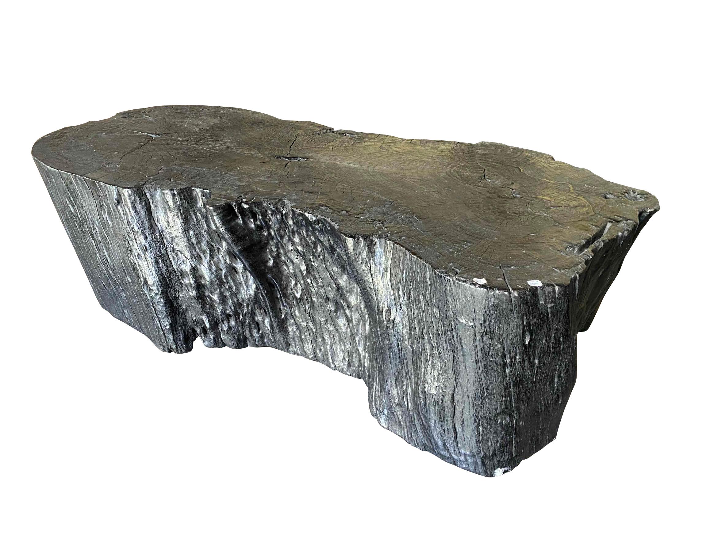 Contemporary Indonesian XL lychee wood organic shape coffee table.
Wood has been charred and then waxed giving it a contemporary look.
 