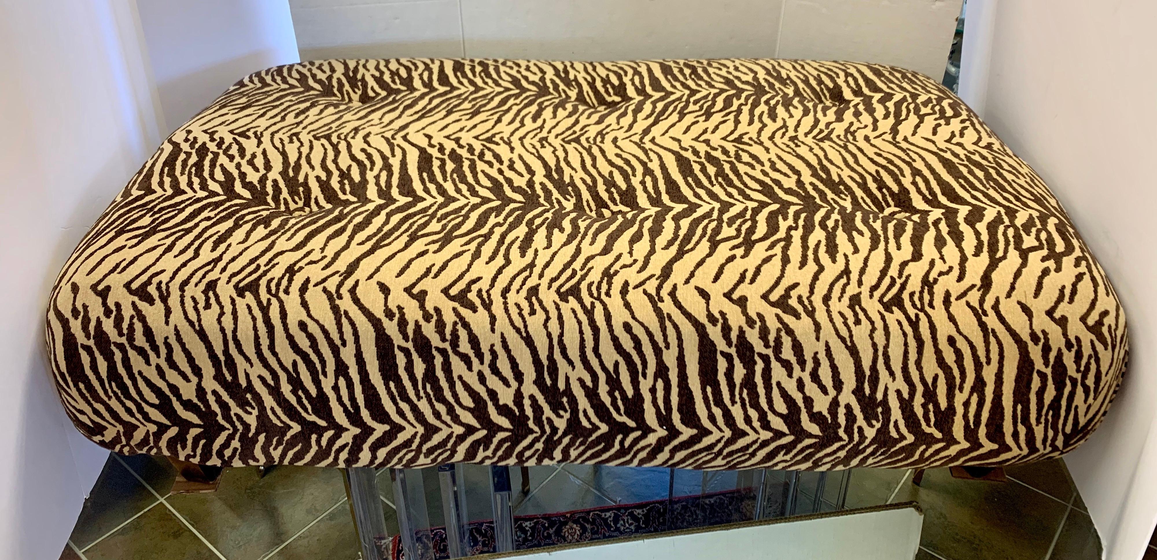 Vintage extra large ottoman newly upholstered in an elegant brown and tan zebra print. Great lines and
better color scheme. All dimensions are below and the piece is in mint condition.