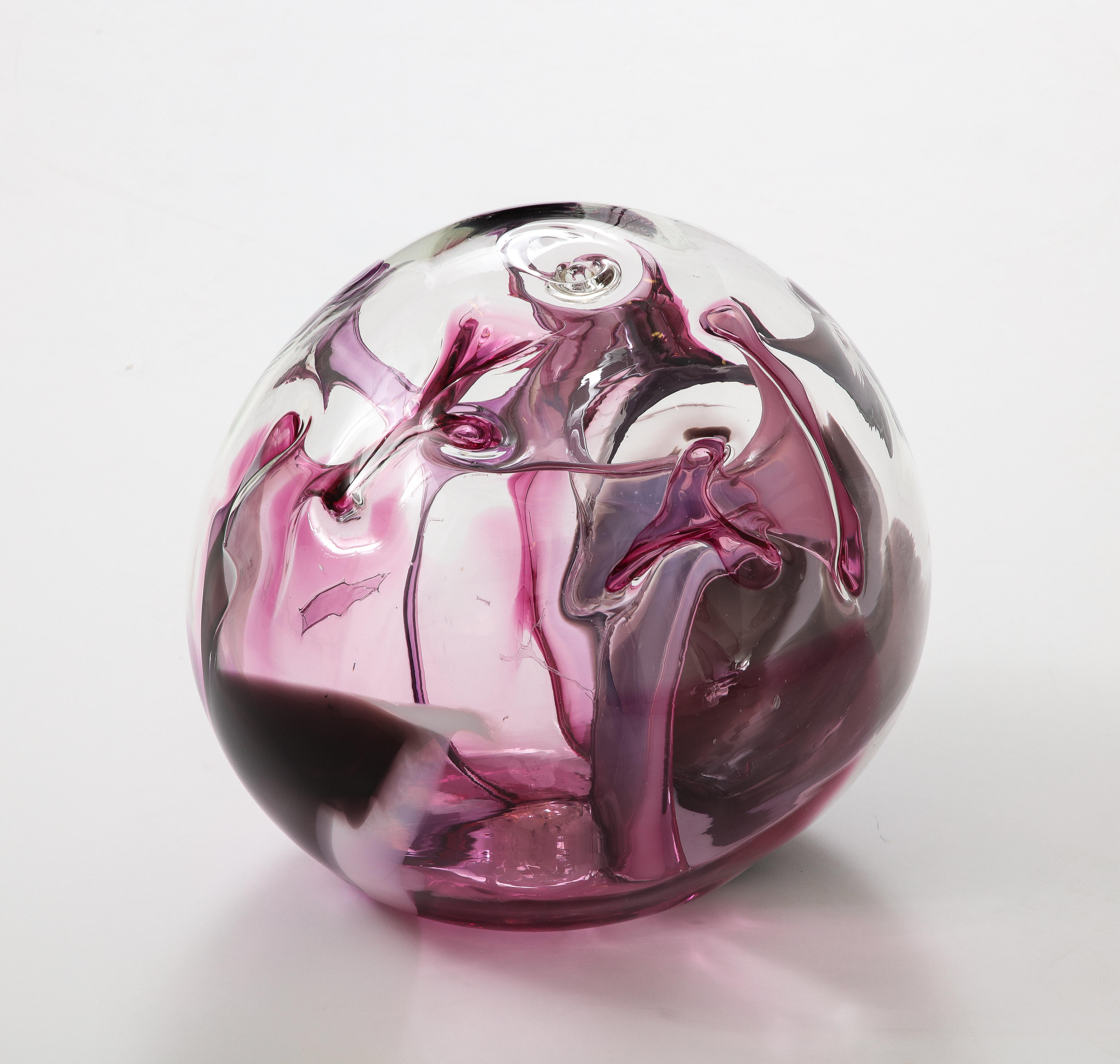 Wonderful Extra large glass orb sculpture by Peter Bramhall.
The blown glass has internal  glass threads of Magenta, Clear and Black and is signed and dated to the bottom 1991.