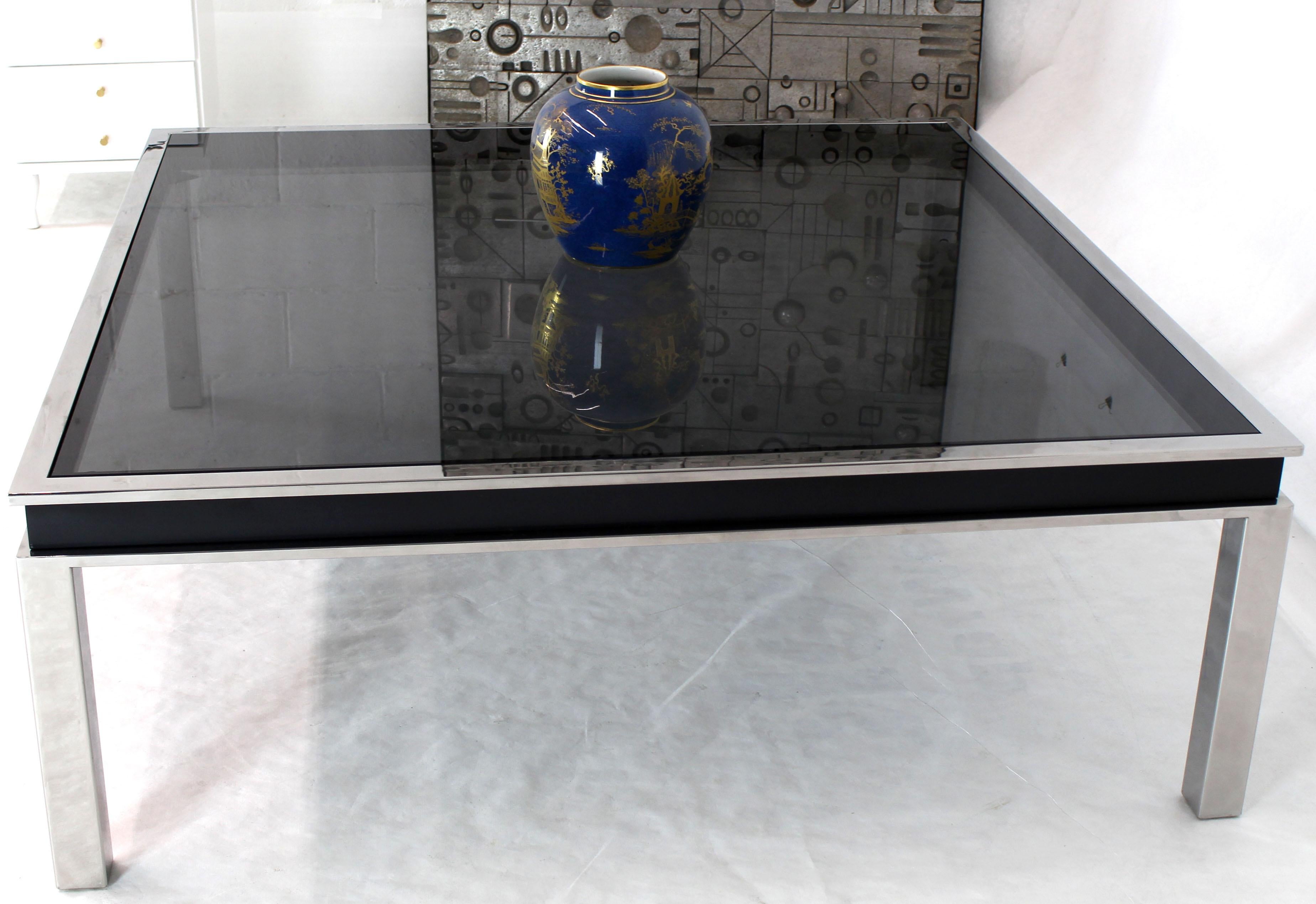 Black onyx glass top extra large 48 x 48 square polished stainless steel center coffee table in style of Milo Baughman.
 