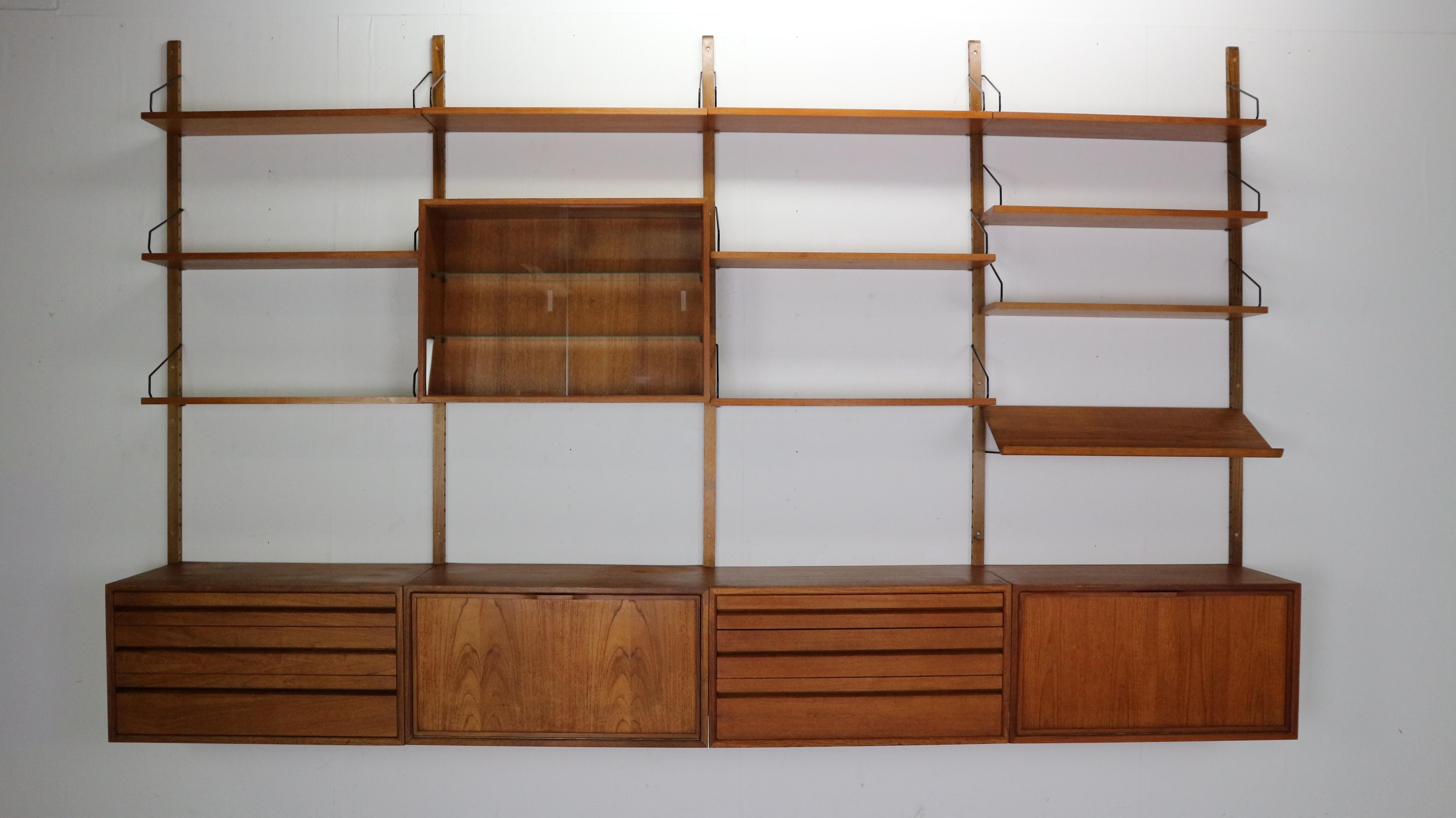 Extra large Danish design wall system or shelving unit by Poul Cadovius for Royal System, designed in Denmark in 1950s.

When you ask someone to think of an European midcentury wall unit, most will probably think of Poul Cadovius and his shelving