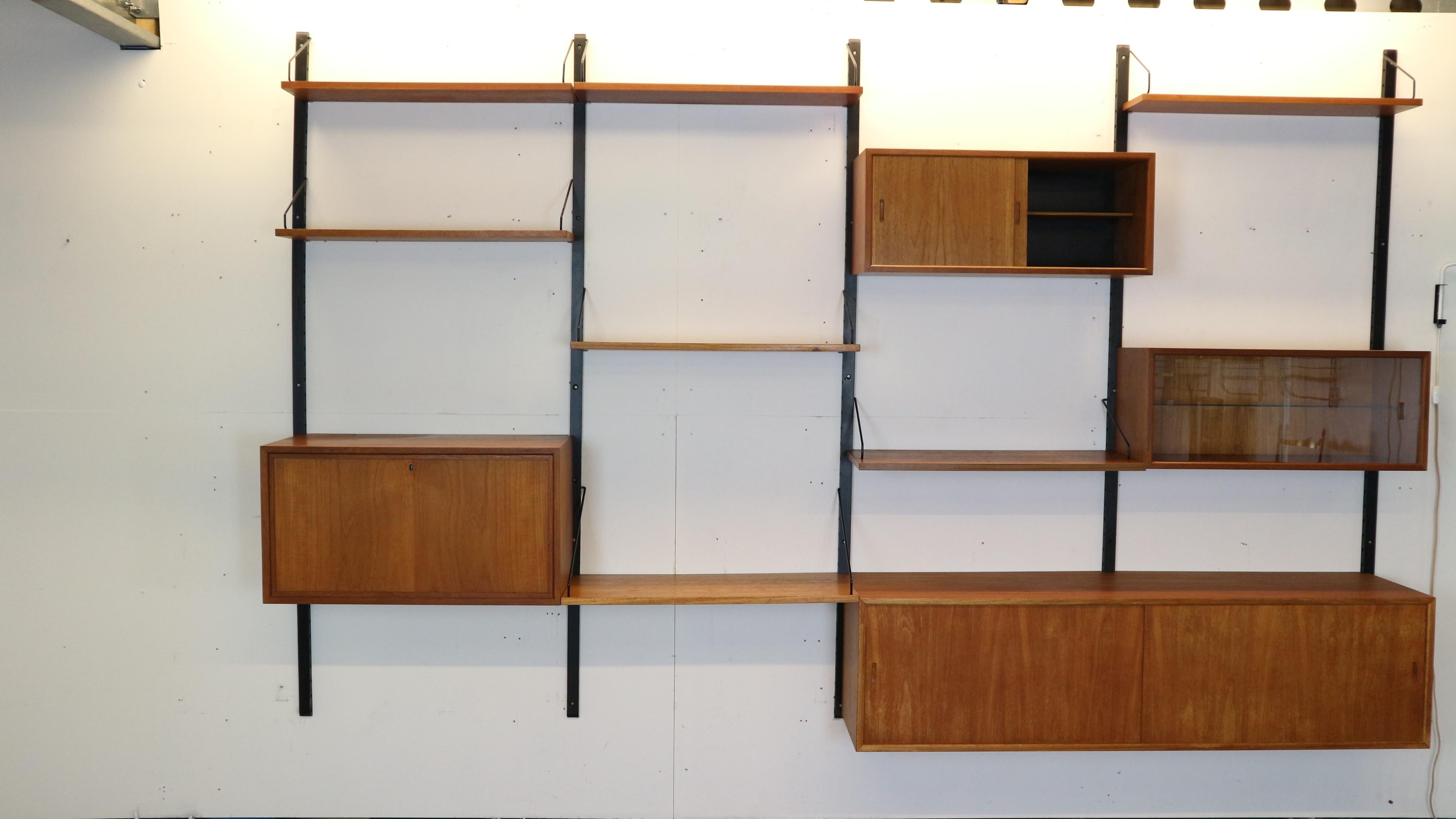 Extra large Danish design wall system or shelving unit by Poul Cadovius for Royal System, designed in Denmark in 1950s.
When you ask someone to think of a European midcentury wall unit, most will probably think of Poul Cadovius and his shelving