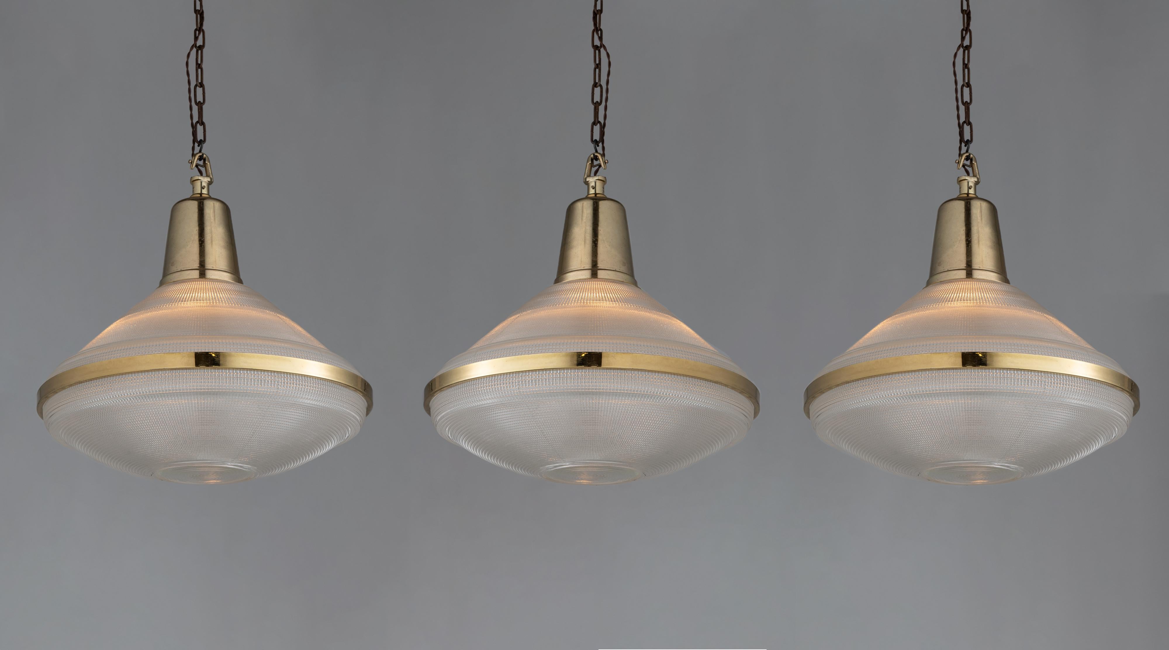 Extra large prismatic deco lights, England circa 1920.

Three part prismatic glass pendant with original heavy brass fitter and surround.

Measures: 22” diameter x 22.25” height.

*Please note the price is per unit, and the lights are sold