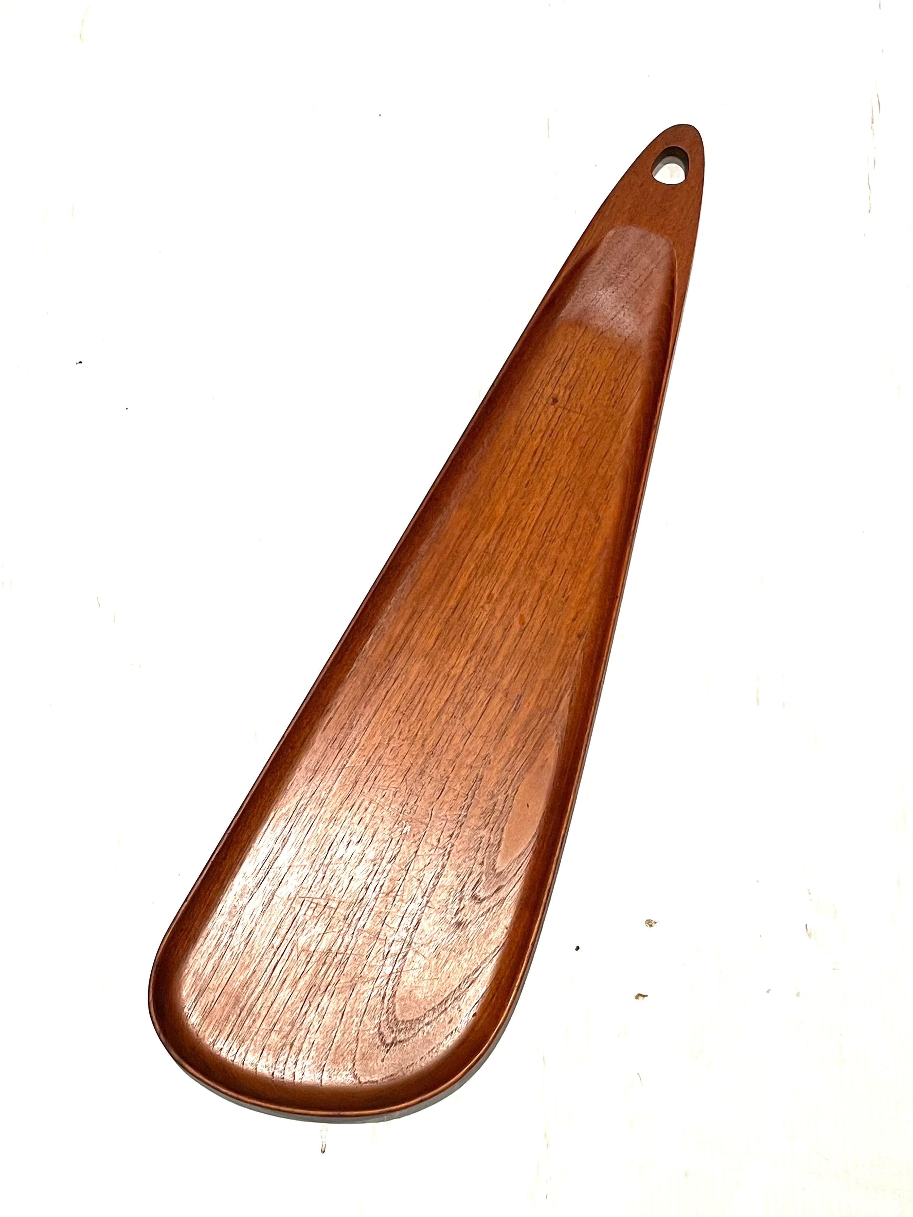 Beautiful rare 1950's solid teak freeform tray, with raised edge and hanging hole stamped at the bottom by Digsmed made in Denmark.