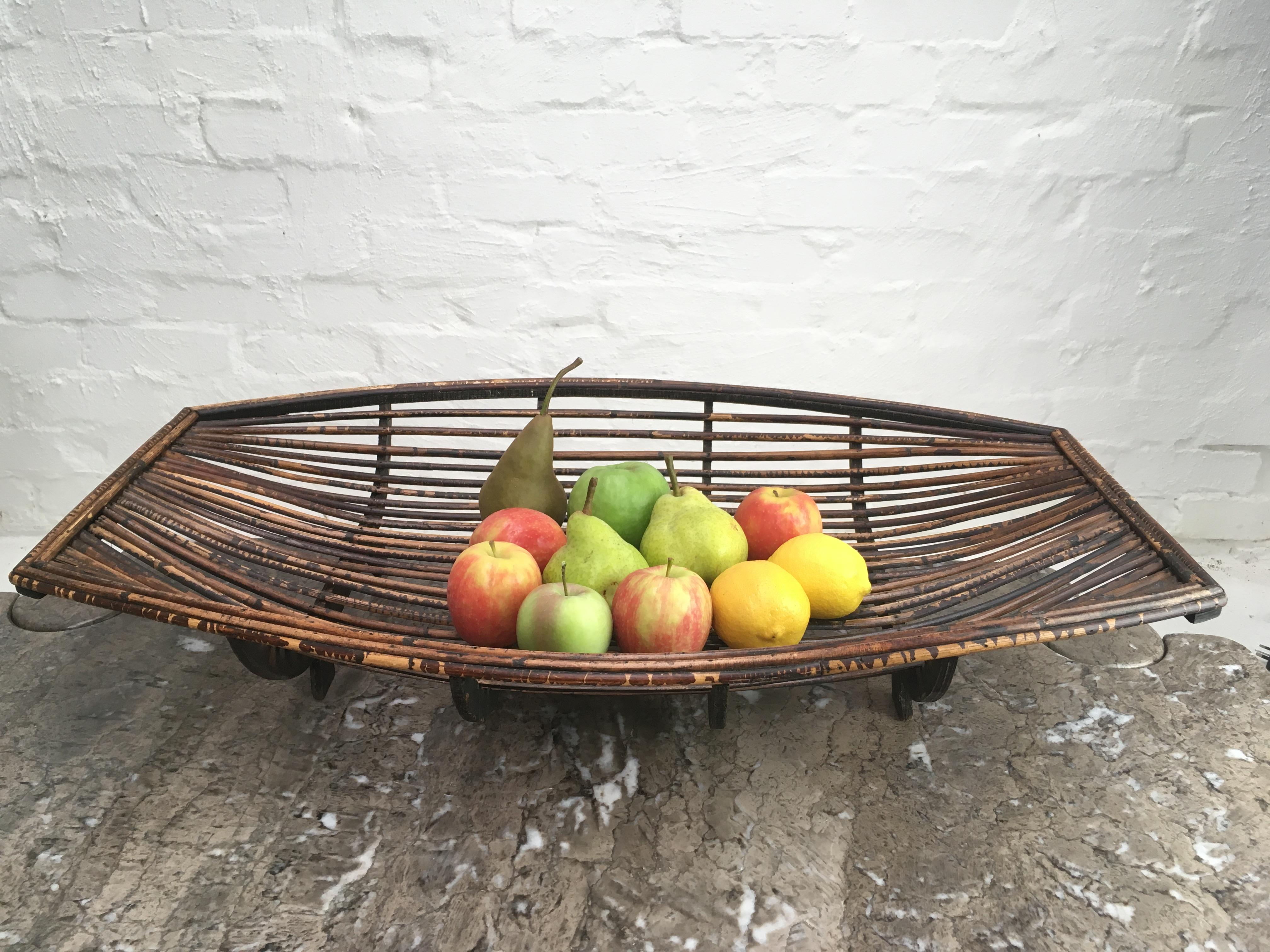 Extra large, beautifully shaped midcentury rattan split cane fruit basket. Constructed of recycled plywood and rattan cane by an unknown designer. Possibly made in the Philippines in the 1960s or 1970s - we have not been able to find further