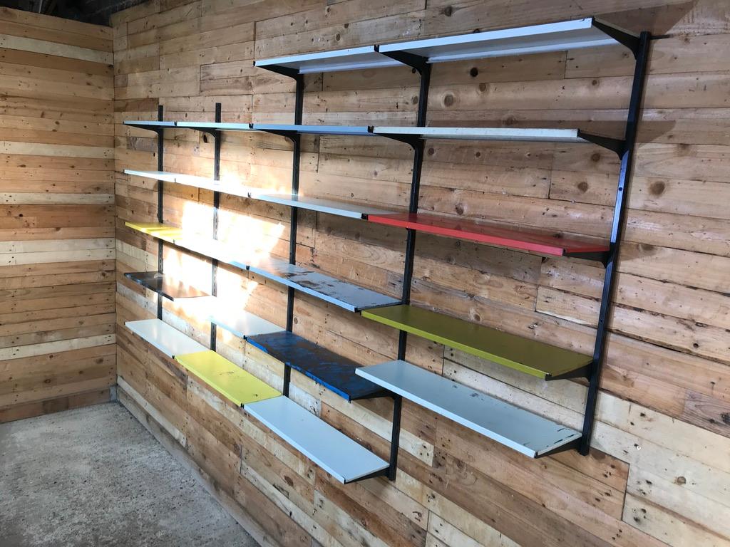 Extra large lovely Pilastro shelving rack in vintage condition, the rack comes 9 wall supports and 21 shelves. 

Very flexible wall unit, wall supports and shelves can be set up anyway you want.

Measures: Height 140cm, Depth 22cm, width 267cm.