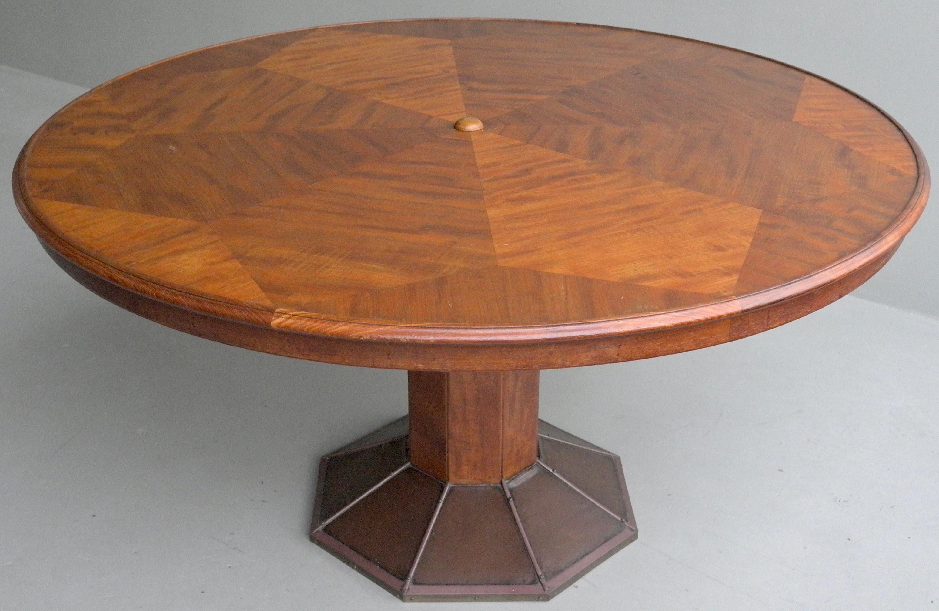 Large round sculptural wooden Art Deco dining table by H.Pander & Zonen. Well made timbered piece, the base has fine copper elements.

Please contact us for worldwide shipping options.