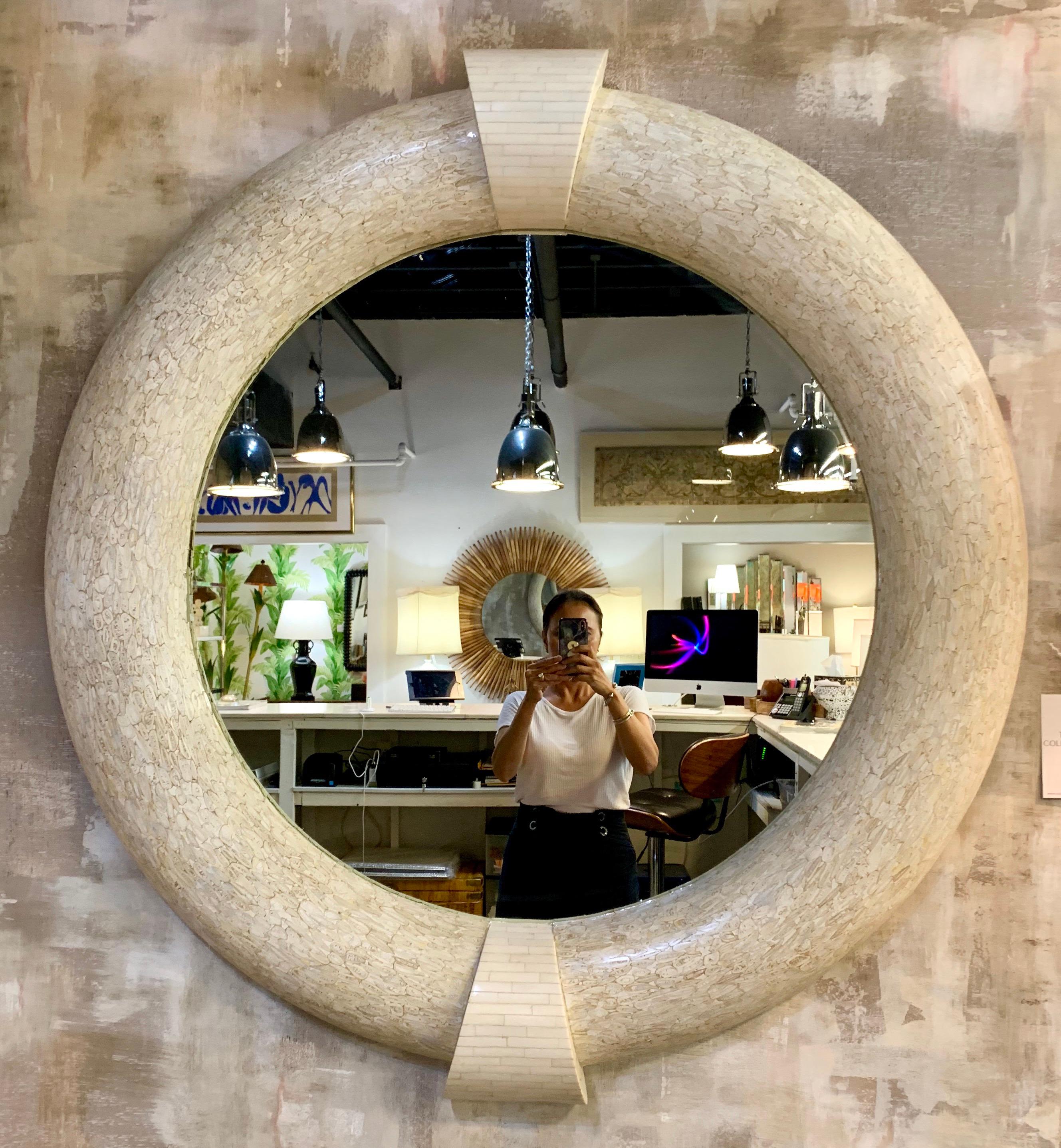 Stunning in its scale as well as craftsmanship. This fifty one inch diameter tessellated round mirror
looks like a work of art. The mosaic work is on point and it makes a great entry piece of art in your home
or workplace. The mirror is not