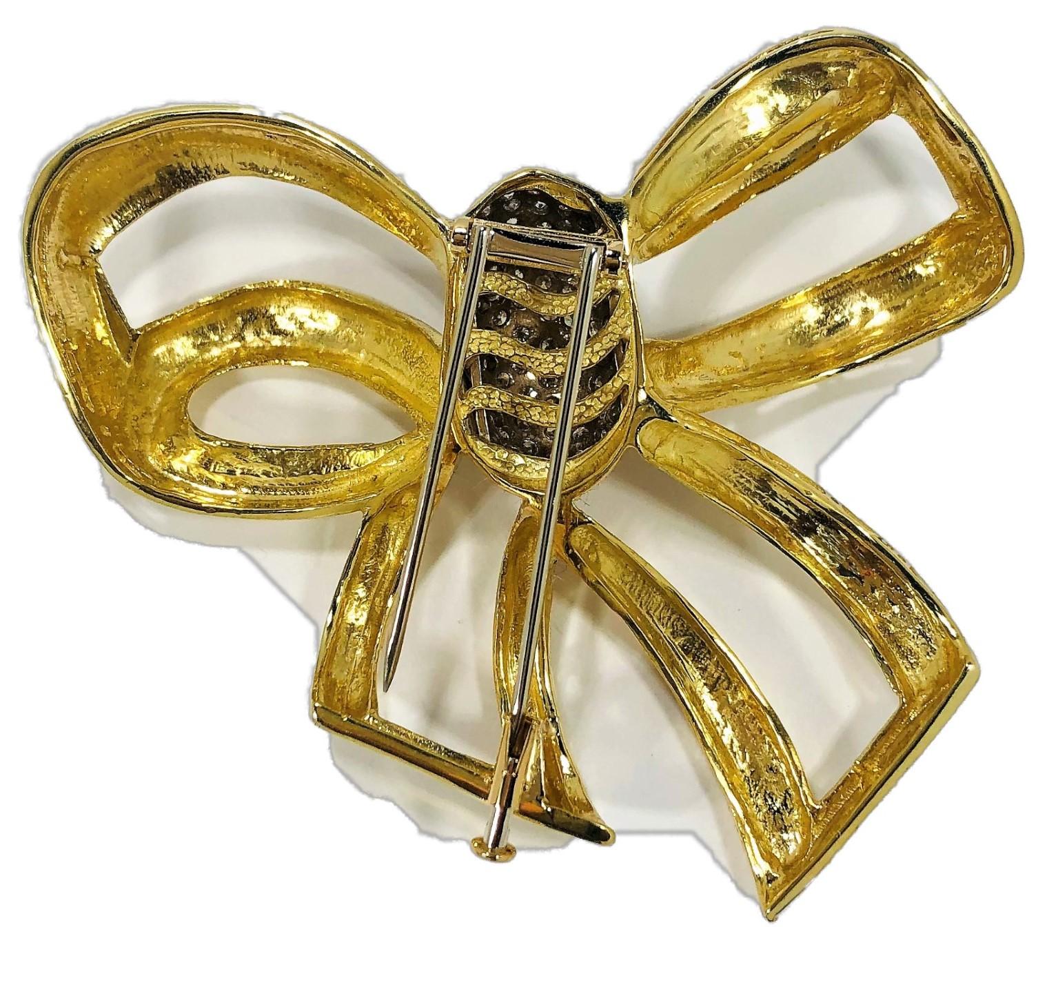 This extra large, stylish and outstanding bow brooch is crafted in 18K Yellow Gold with a White Gold pave diamond dome in the center. The dome is set with brilliant cut diamonds weighing an approximate total of 2.0CT of overall H Color and SI1