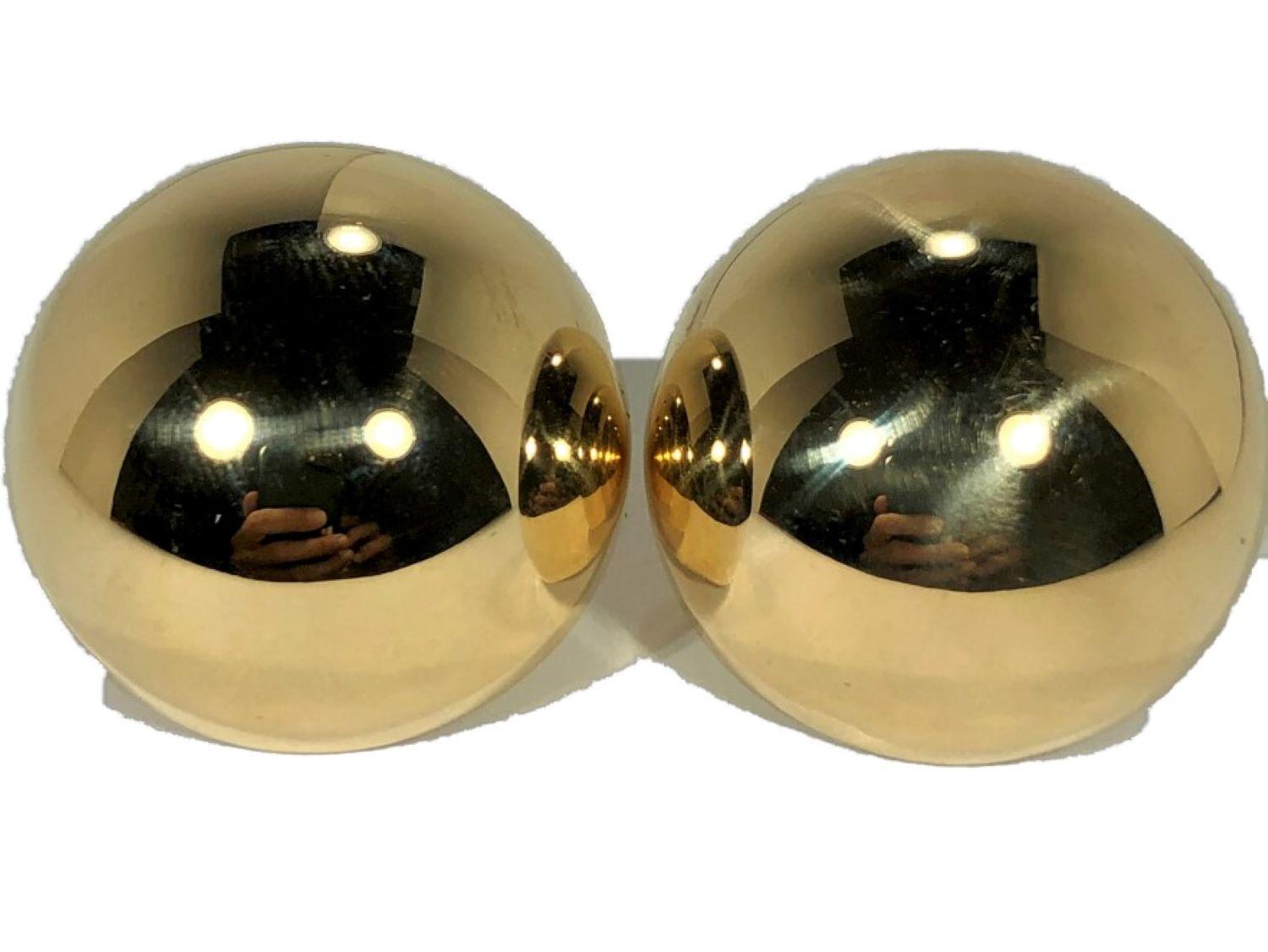 These extra large, vintage, 14k yellow gold dome earrings are similar to other earrings of this style with one notable exception. They are enormous, measuring a full 1 1/4 inches in diameter and 3/4 inches high at their apex. High polish finish.