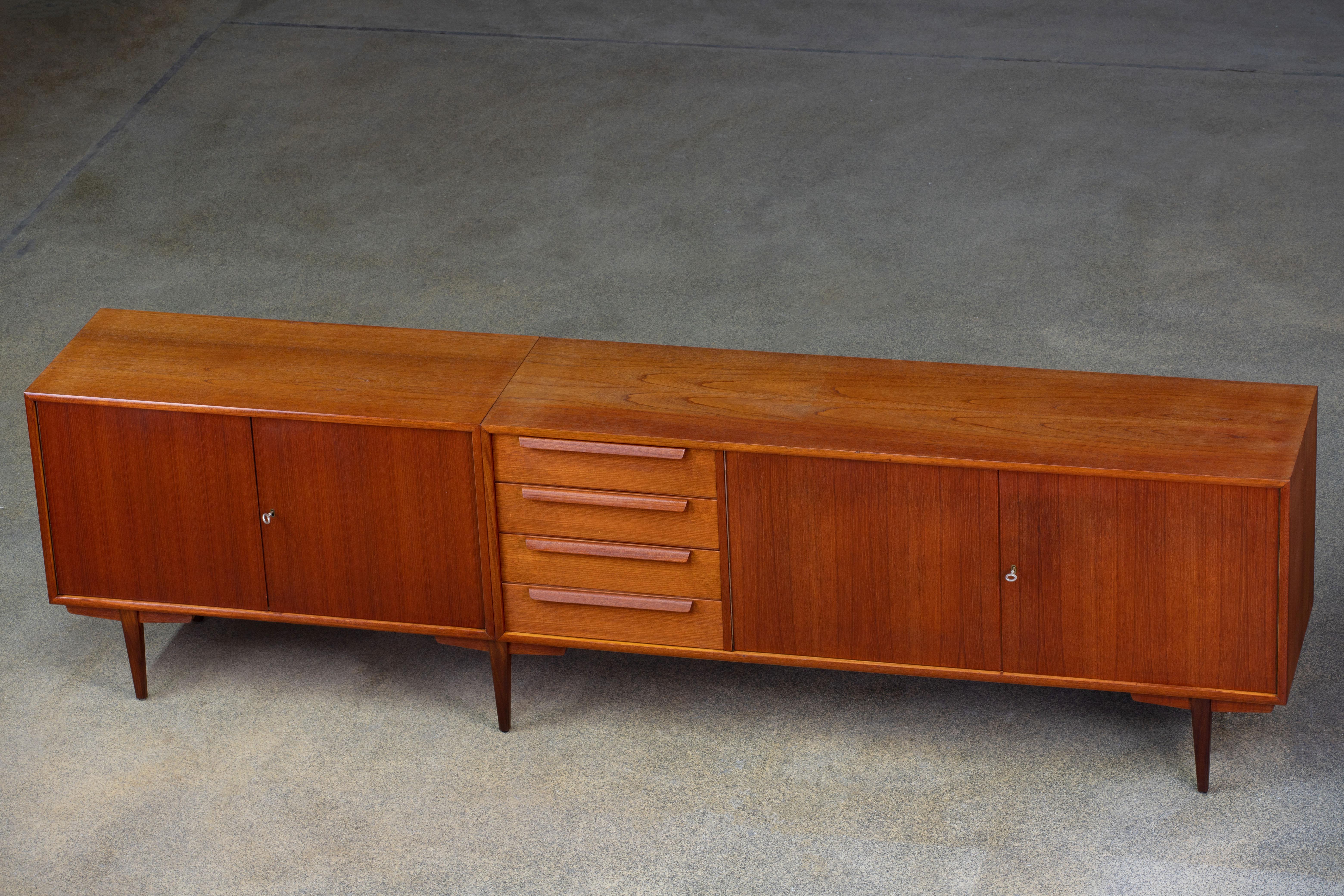 Danish sideboard in teak from the 1960s.
An elegant piece designed in two parts joined with a central  pair of legs.
Good condition with minor wear.