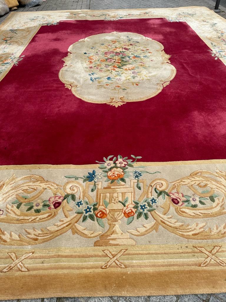 Discover the timeless elegance of our Wonderful Palace Size Hand Tufted Rug. This exquisite piece, crafted in China during the 1970s-1980s, showcases a stunning design reminiscent of French Savonnerie carpets, capturing the essence of Napoleon III