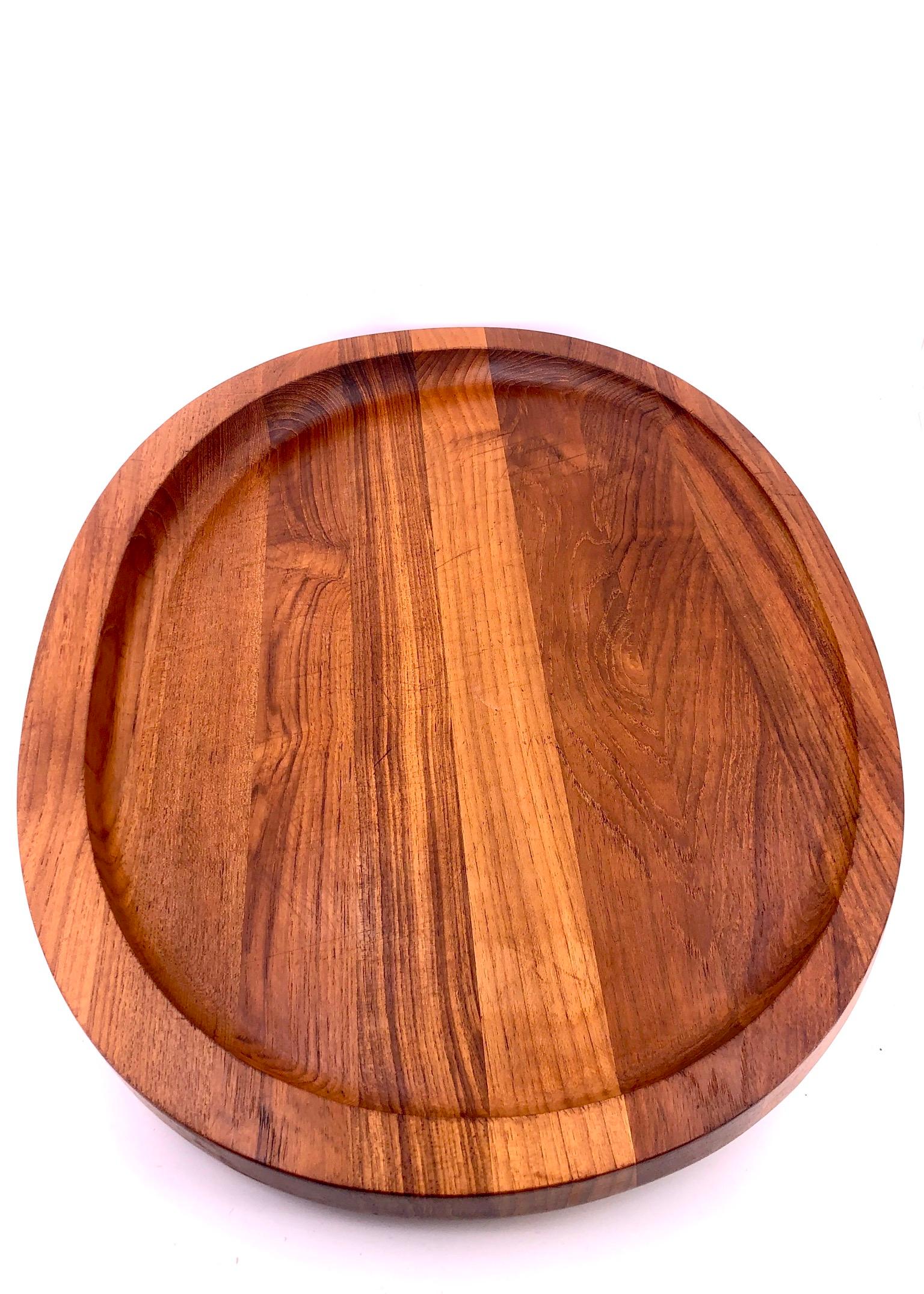 Beautiful large solid teak tray designed by Quistgaard for Dansk, circa 1960s freshly refinish. With slanted top to catch the juices from the meats.