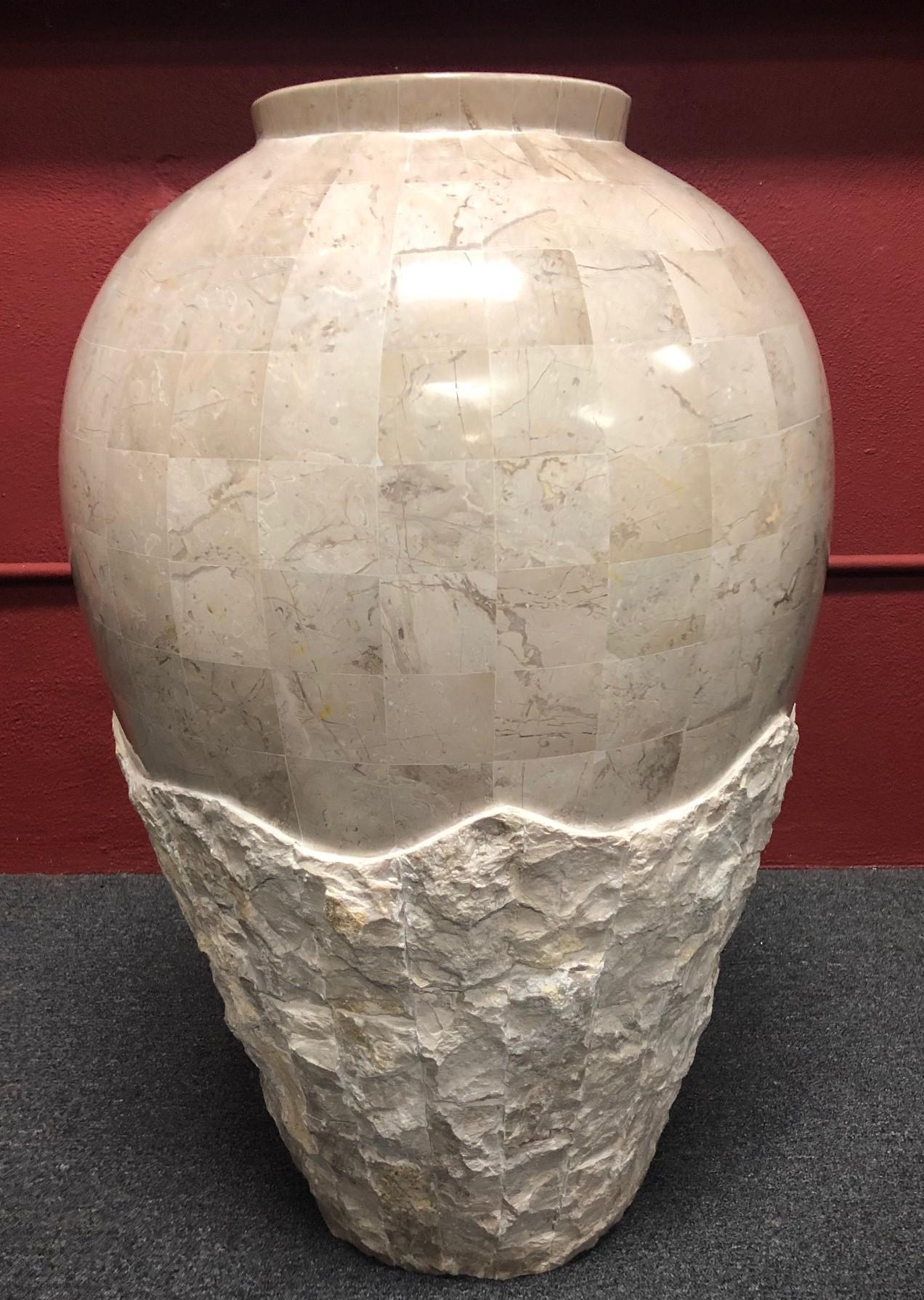A very nice extra large tessellated stone floor vase / planter / jar by Marquis of Beverly Hills, circa 1990s. The bottom portion of the piece has a rugged stone exterior that melds into the smooth, polished top portion.
 
