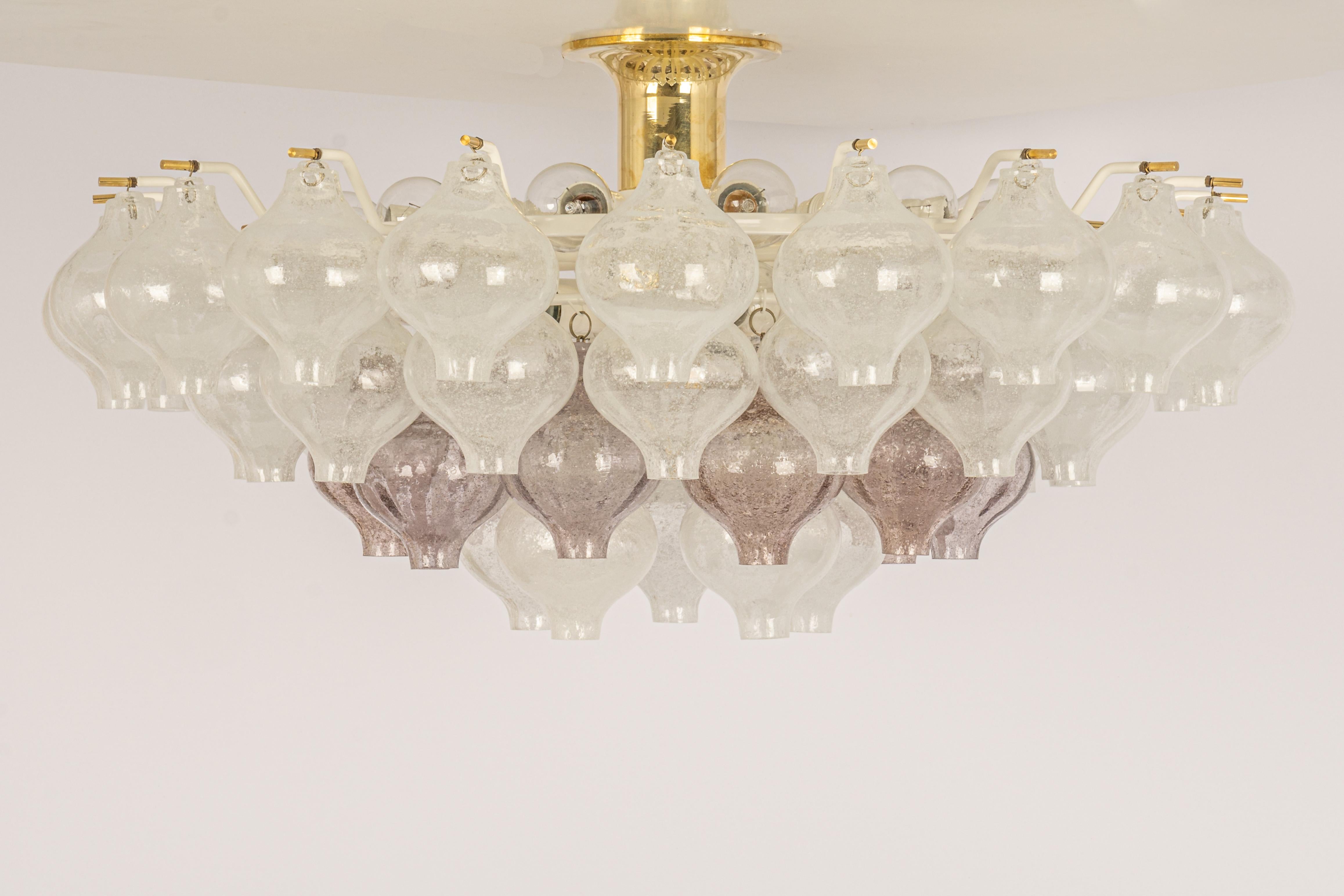 Wonderful onion-shaped -Tulipan glass chandelier. 50 hand-blown glasses suspended on a white painted metal frame.
Best of design from the 1960s by Kalmar, Austria. High quality of the materials.

Sockets: The chandelier takes 21 small screw base