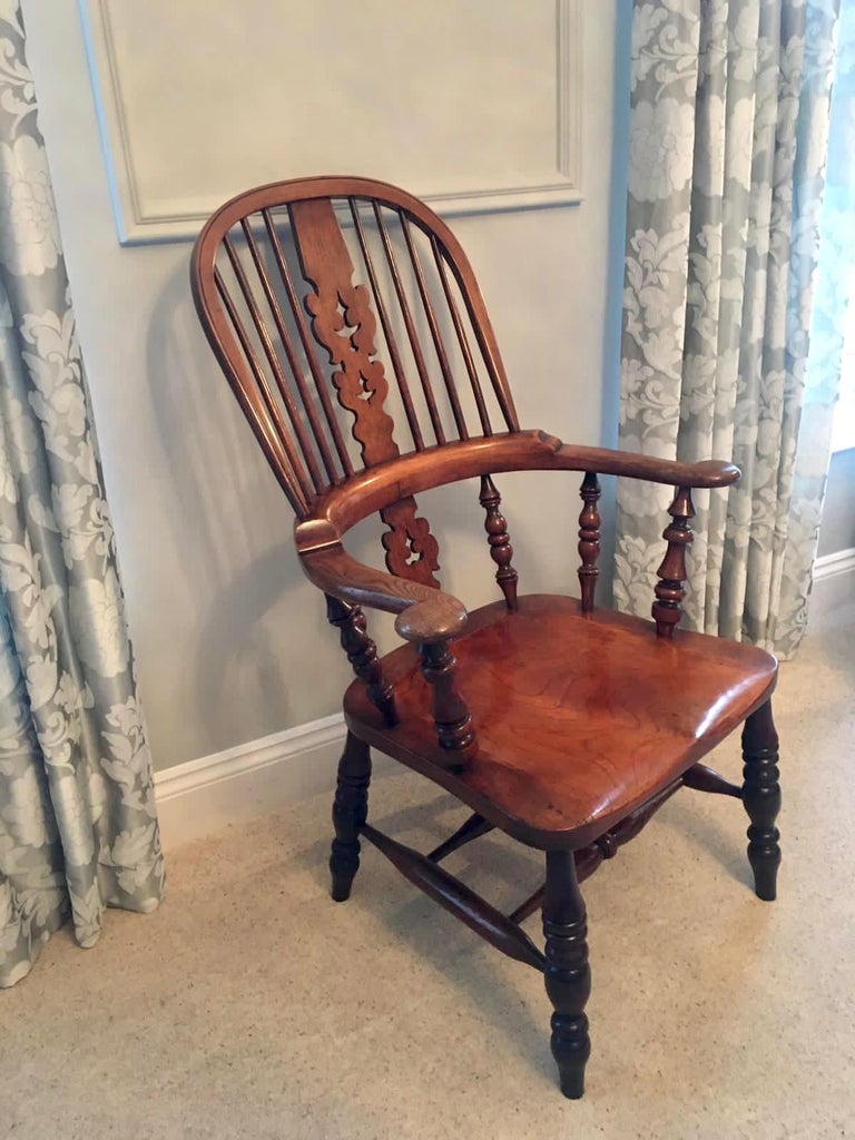 Extra large Victorian antique Victorian hoop back broad arm Windsor chair of unusual large proportions with a Christmas tree centre splat and having a wonderful elm seat with the rest being oak.

This is a very splendid example in fabulous