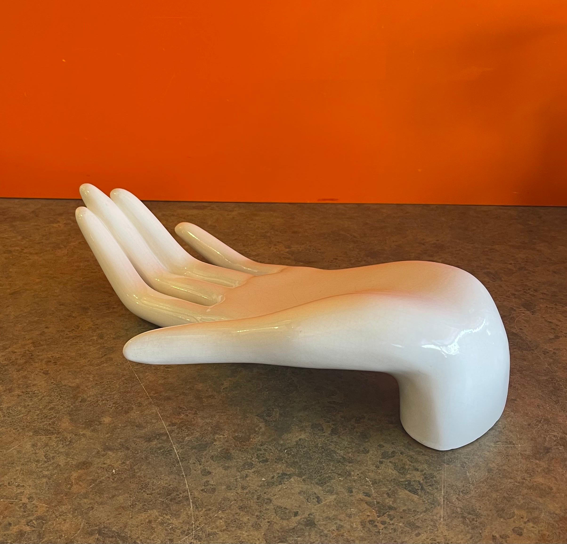 Extra large vintage white ceramic resting hand sculpture, circa 1970s. The piece is in good vintage condition with no chips or cracks (there is some crazing throughout the piece; please see pictures. Definitely adds to the character) and measures