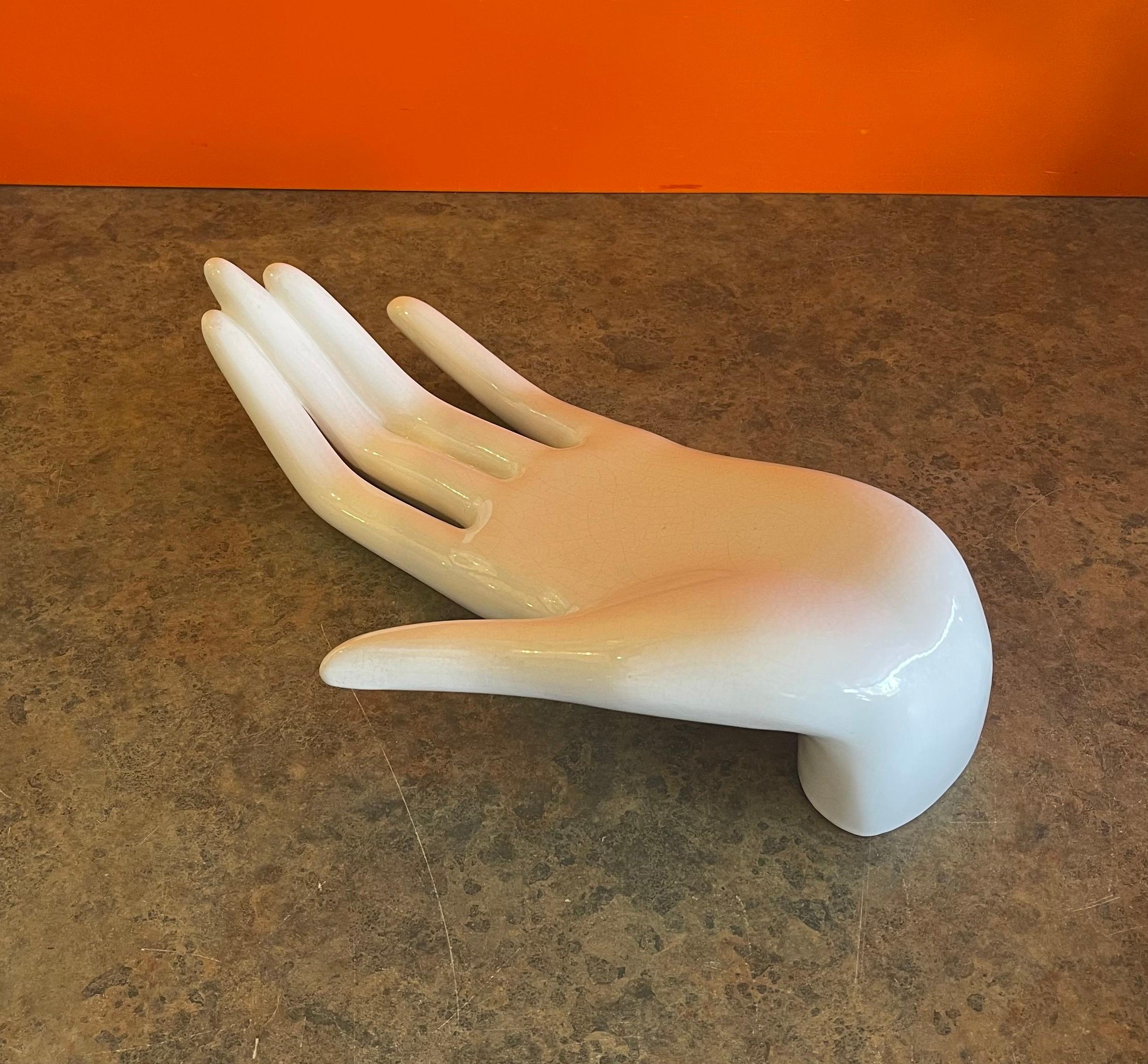 large hand sculpture