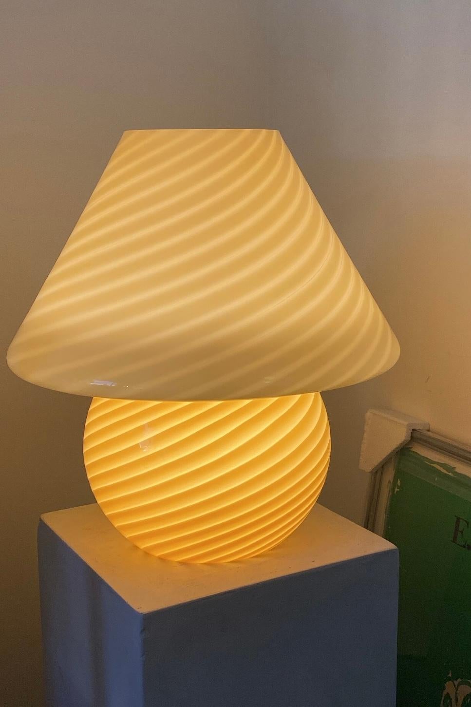 Extra large vintage Murano mushroom table lamp in a very nice sunny yellow shade. Mouth-blown in one piece of glass with a swirl pattern. Handmade in Italy, 1960s-1970s, and comes with new white cord.
Measures: ?H: 38 cm D: 34 cm?