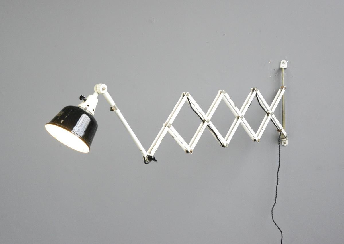 Extra-large wall-mounted scissor lamp by Midgard, circa 1940s

- Large extendable scissor mechanism
- Vitreous black enamel shade
- Takes E27 fitting bulbs
- German, 1940s
- Measures: 41 cm tall x 17 cm wide
- Extends up to 165 cm from the