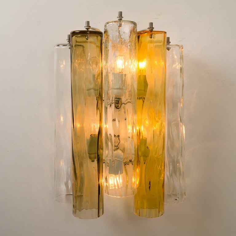 Wonderful extra-large midcentury Barovier & Toso wall sconces. This wall sconces are executed to a very high standard. The lights feature a frame with five large Murano tubes in light and darker ocher and clear glass. The tubes diffuse the light
