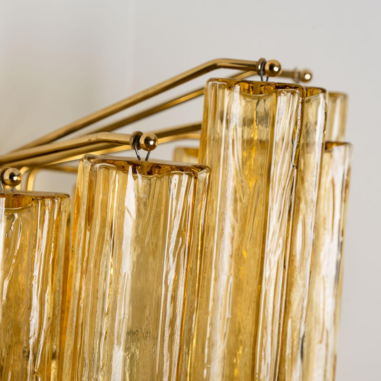 Wonderful extra-large mid century Barovier & Toso wall sconces. This wall sconces are executed to a very high standard. The lights feature a frame with five large Murano tubes in ocher glass. The tubes diffuse the light beautifully to give a soft,