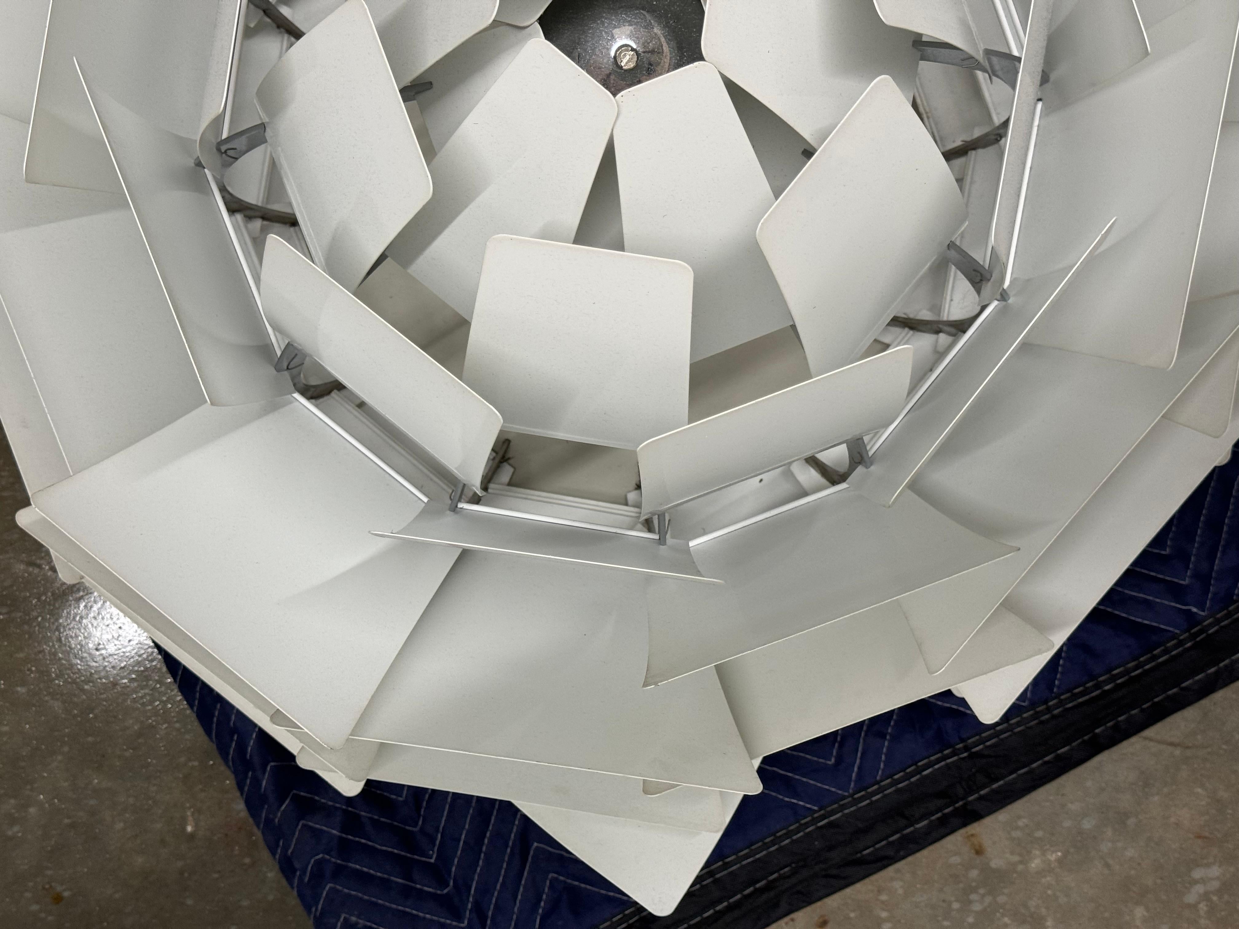 The PH Artichoke Pendant is a stunning addition to any indoor space, boasting a sleek
stainless steel construction and a soft white color that complements any room.

With its sensor light type, this pendant adds a touch of sophistication to